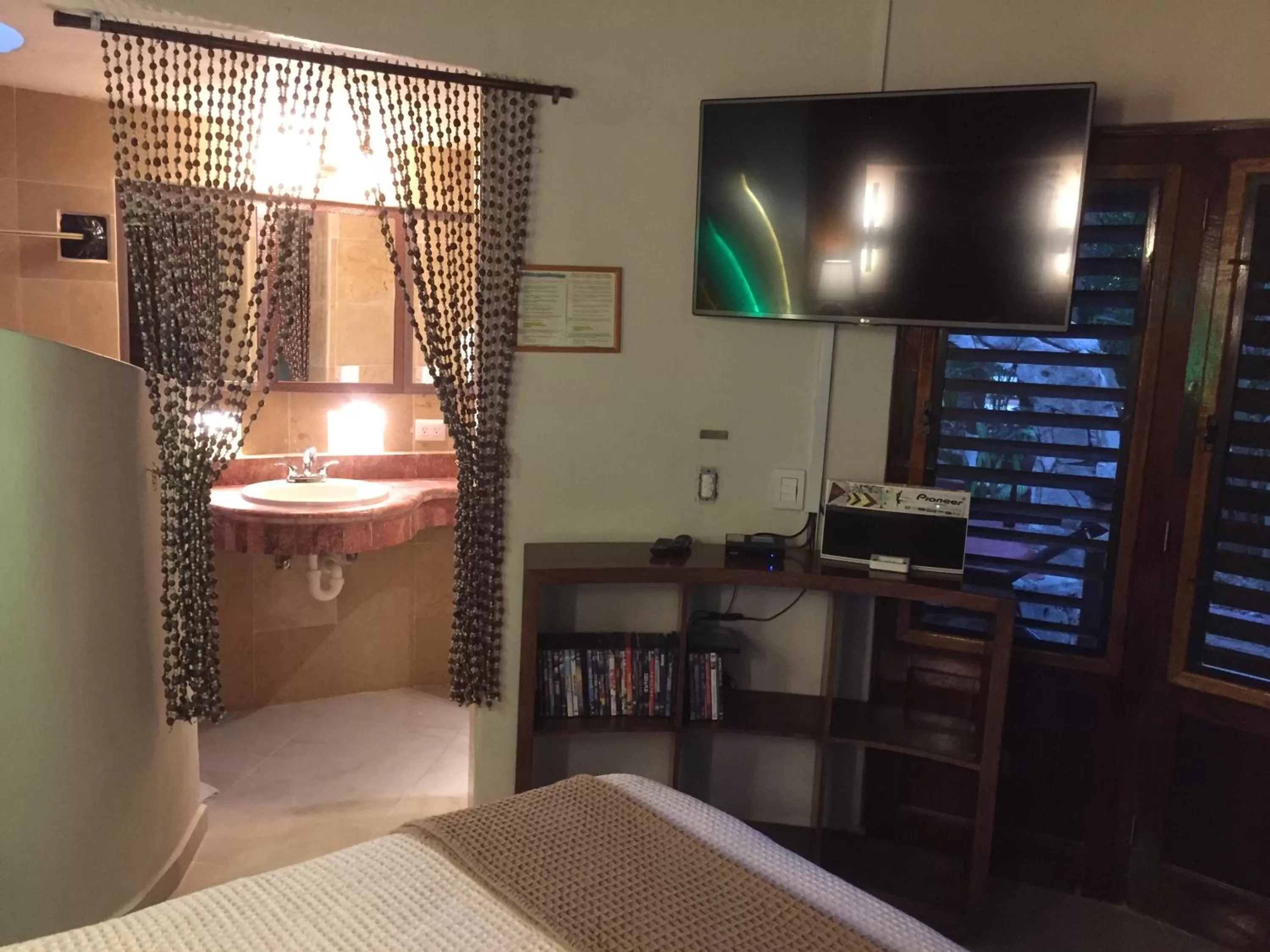 Photo of the whole room, Bed in Cocos Cabañas Playa del Carmen Adults Only