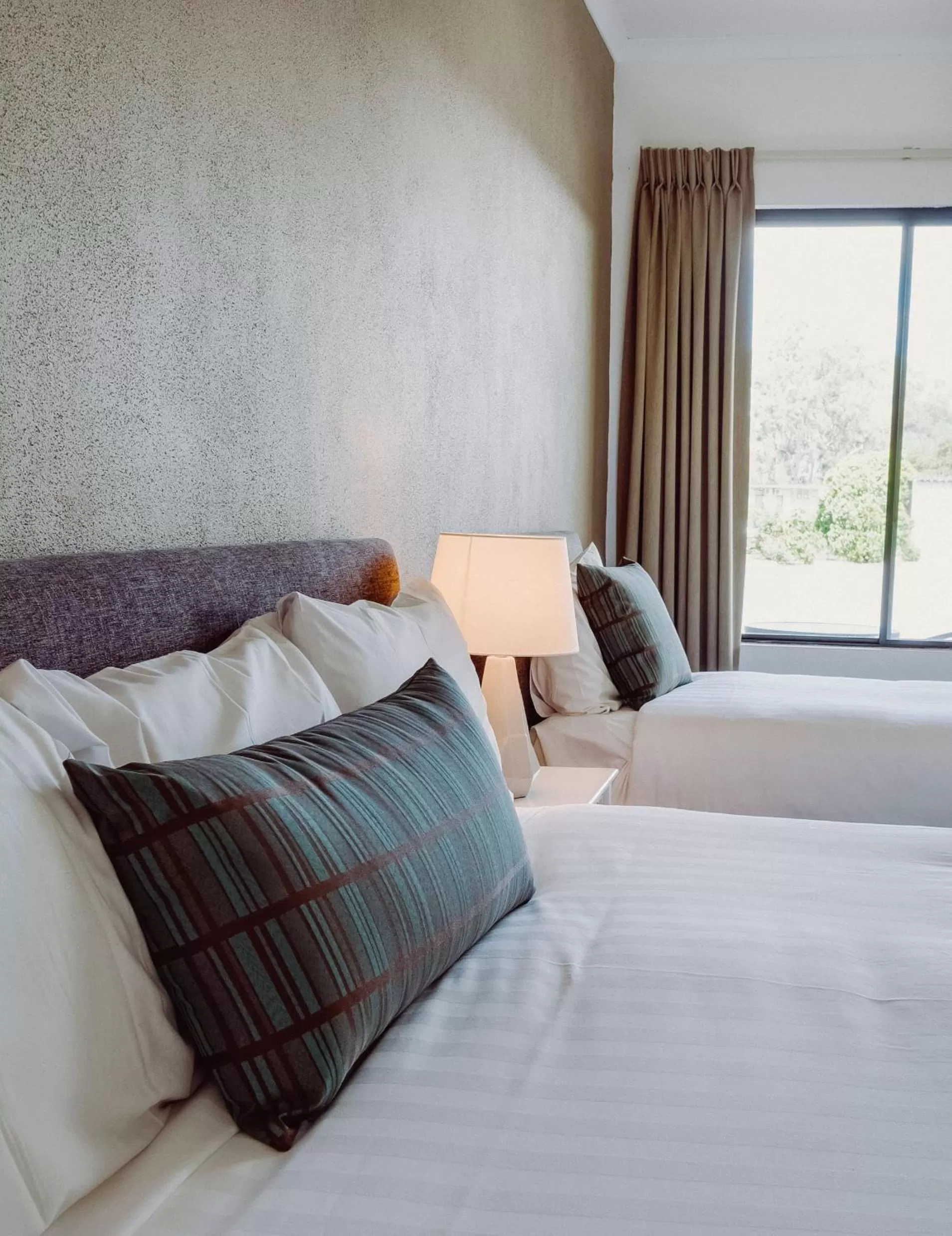 Bed in Artesian Spa Motel