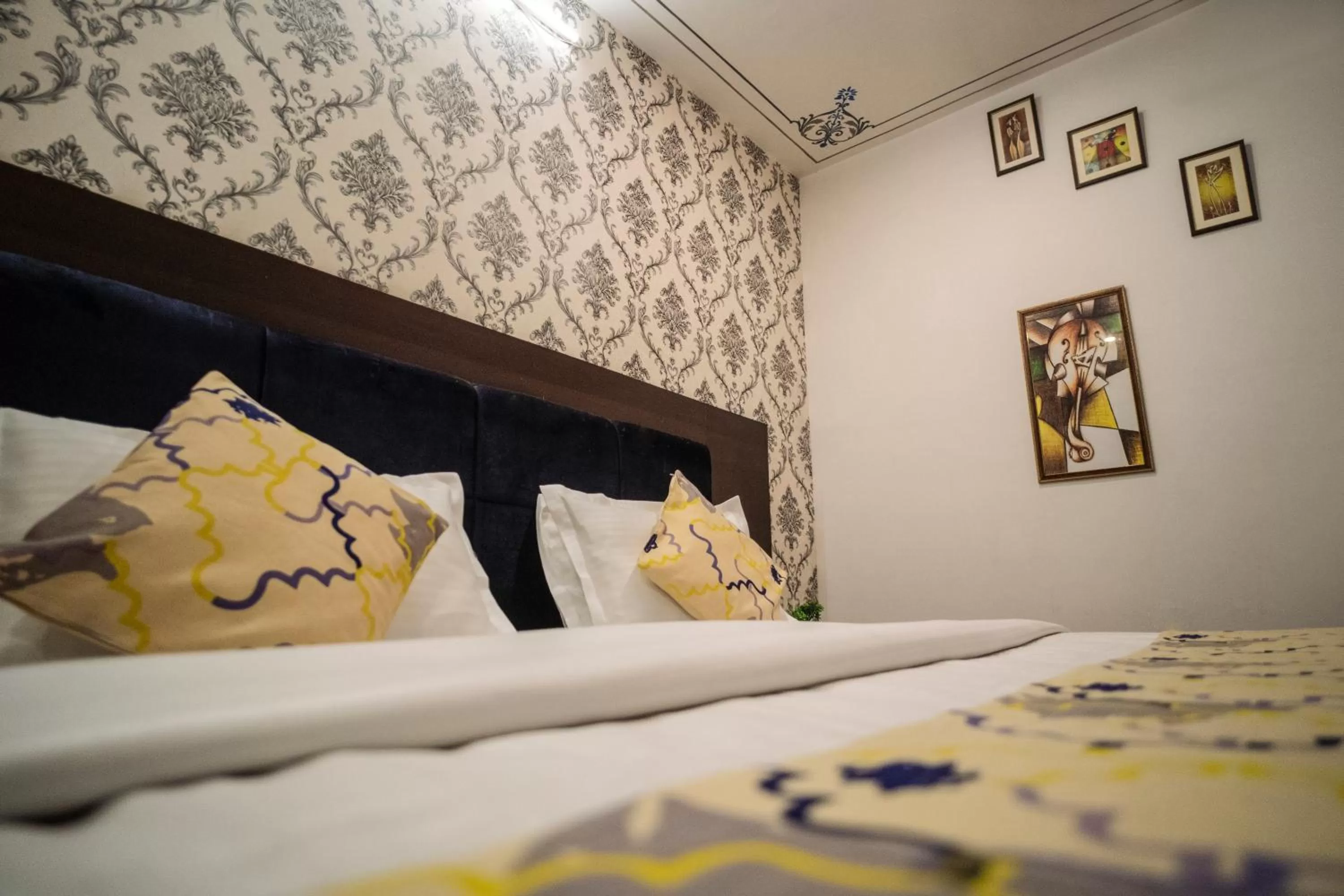 Bed in Tripli Hotels Arunoday Palace