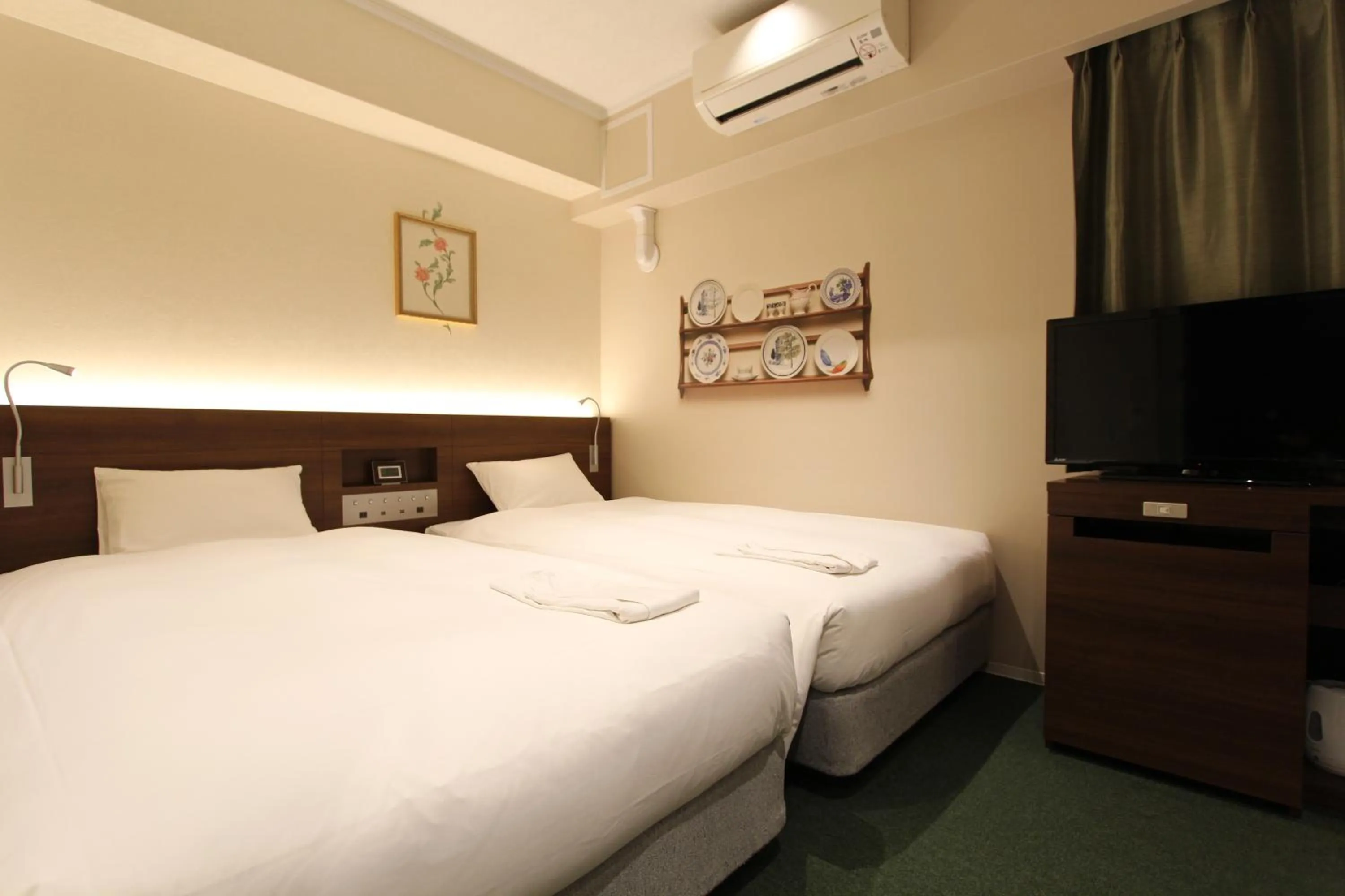 Bed in KOKO HOTEL Osaka Namba Ebisucho