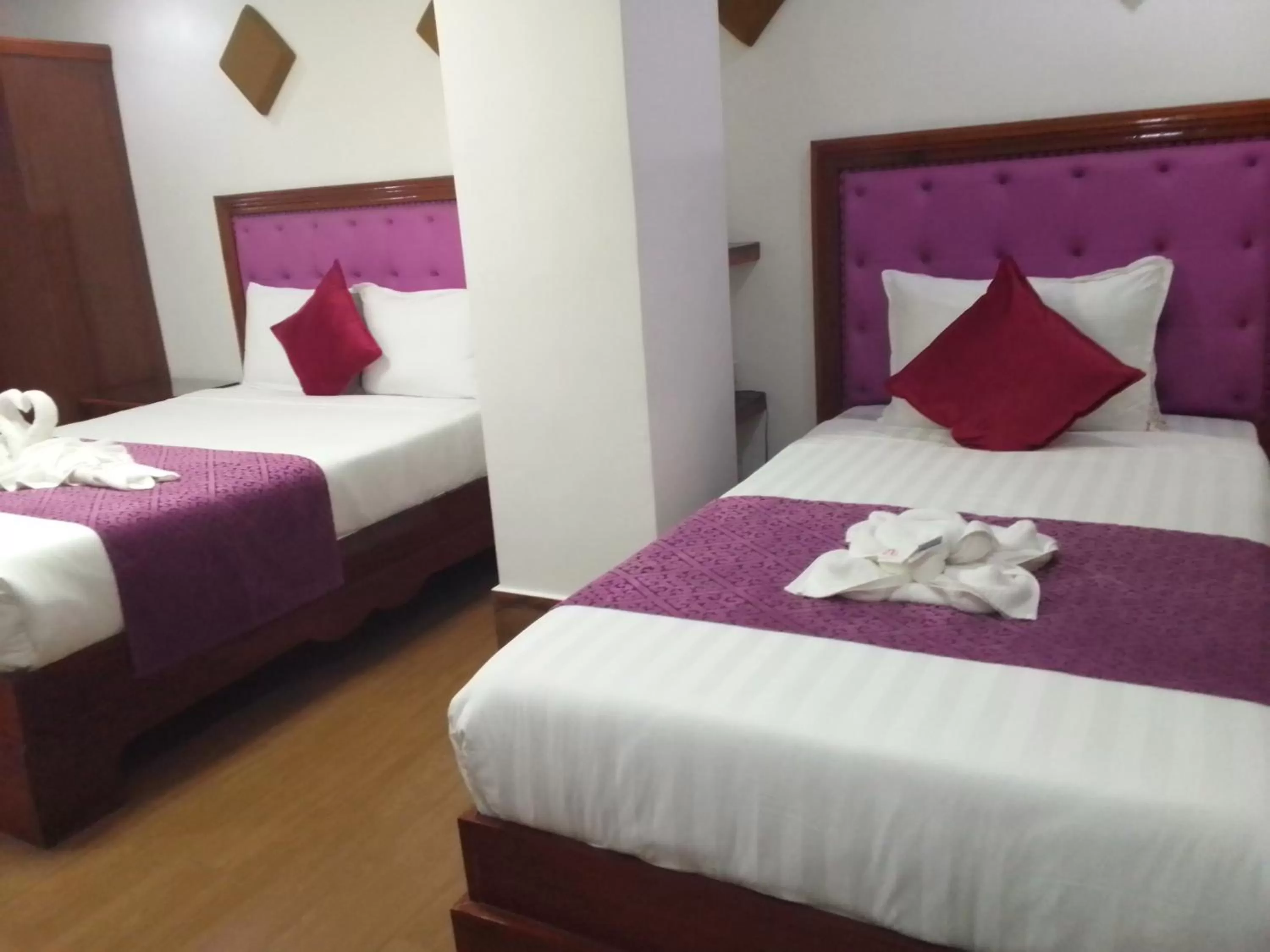 Bed in CLN Boutique Hotel