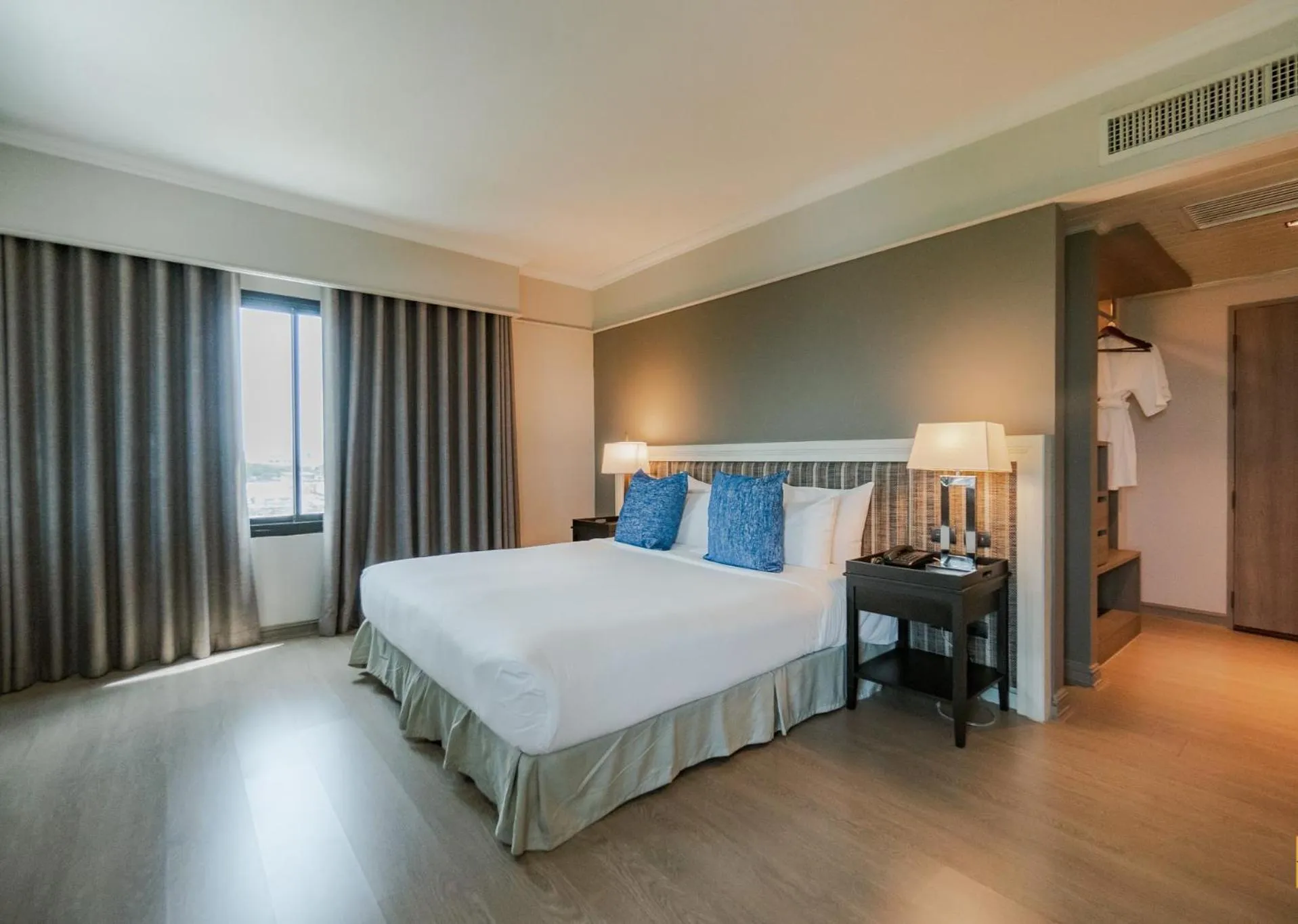 Bed in The Grand Riverside Hotel