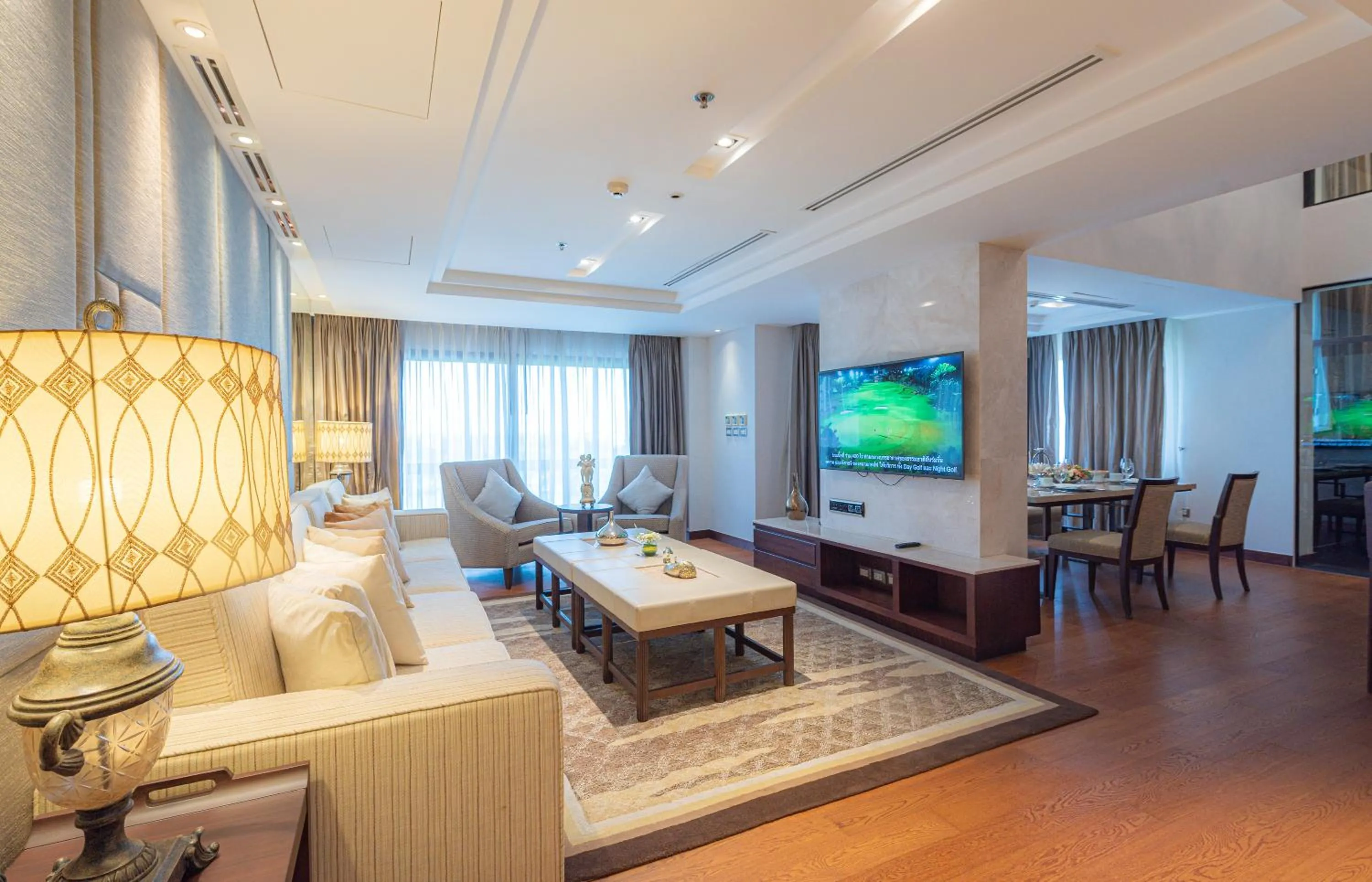 Living room in Summit Windmill Golf Suite Hotel at Suvarnabhumi