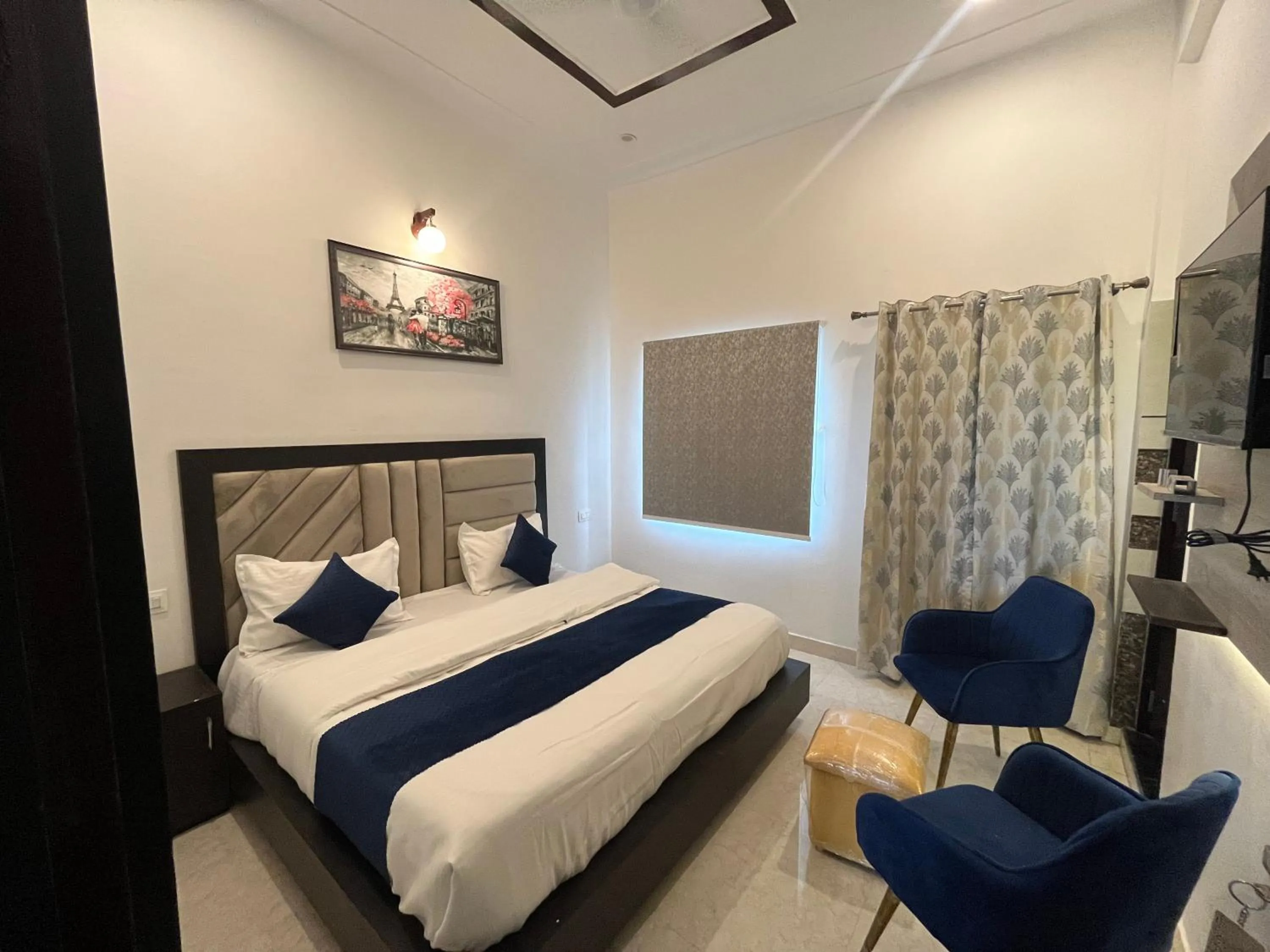 Bed in The nines hotel & restro