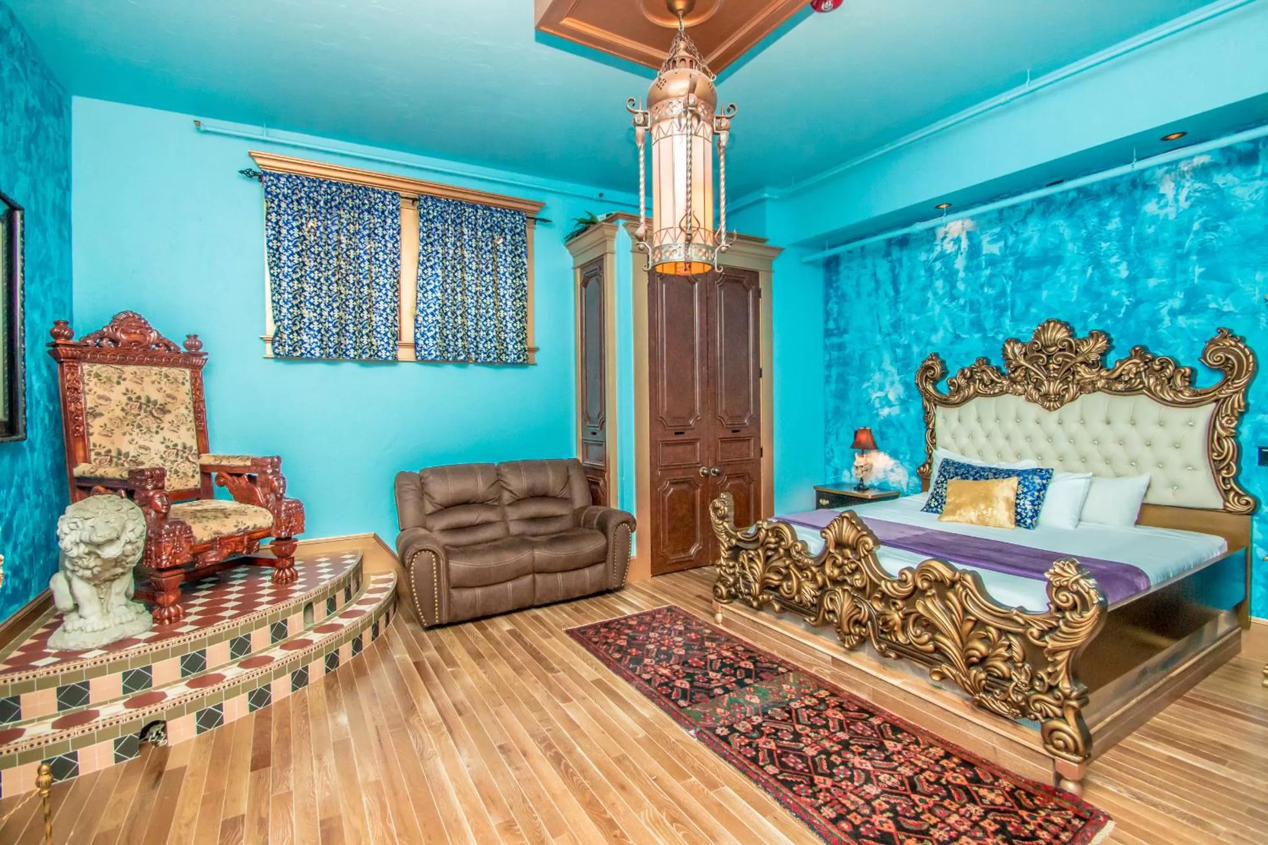 Bed, Seating Area in Adventure Suites