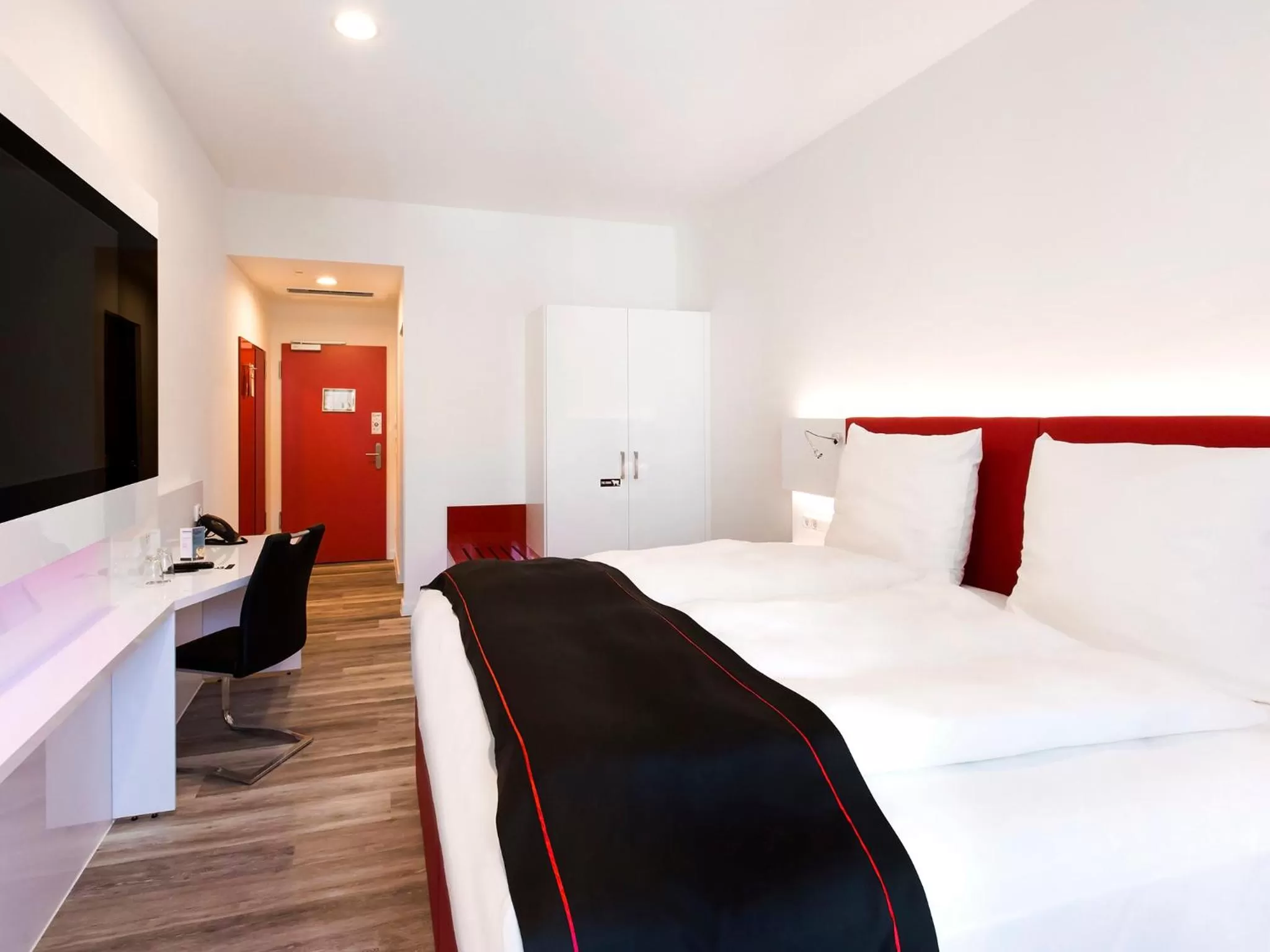 Bed in DORMERO Hotel Roth