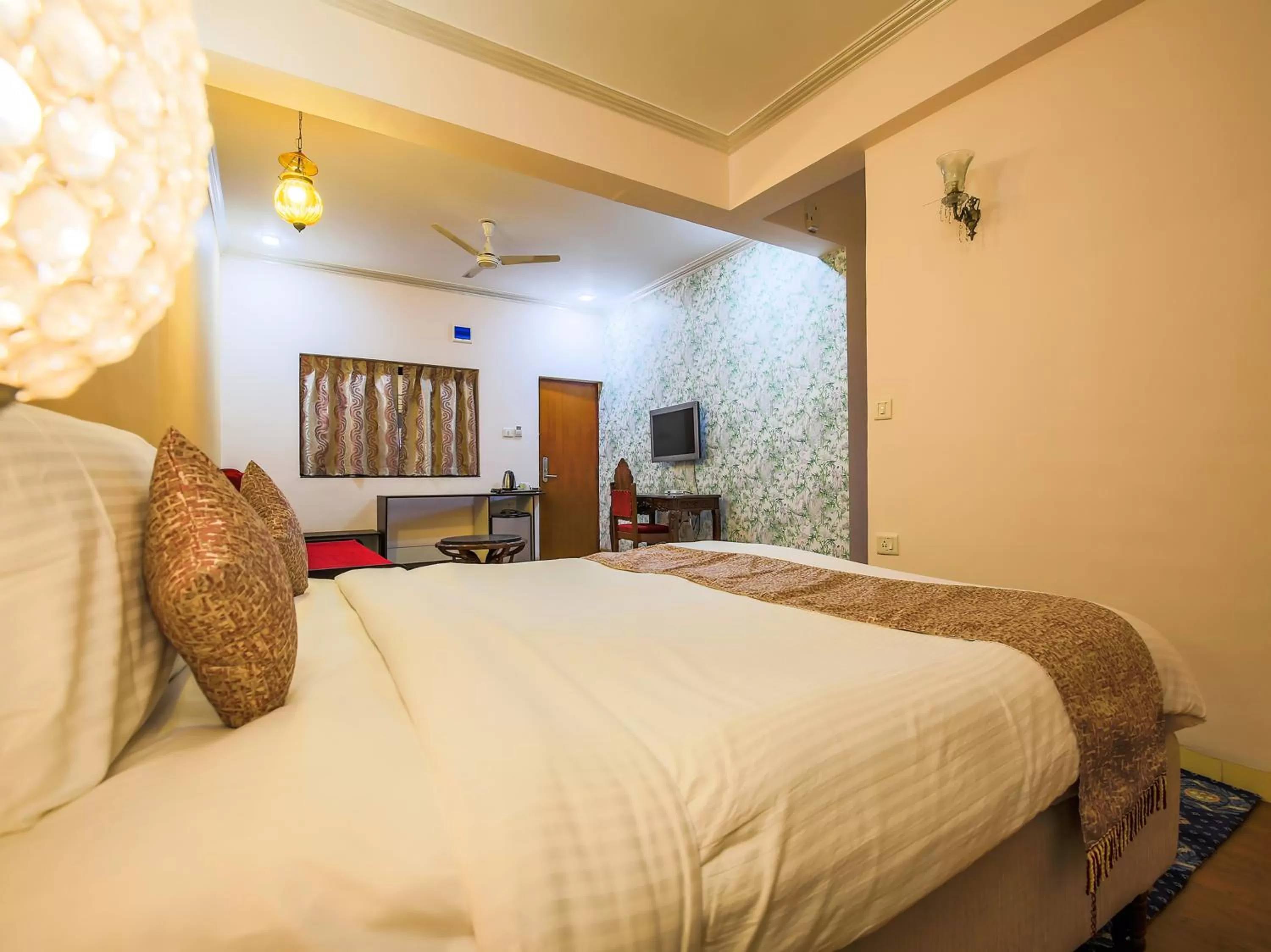 Bed in The Center Court Resort & Spa