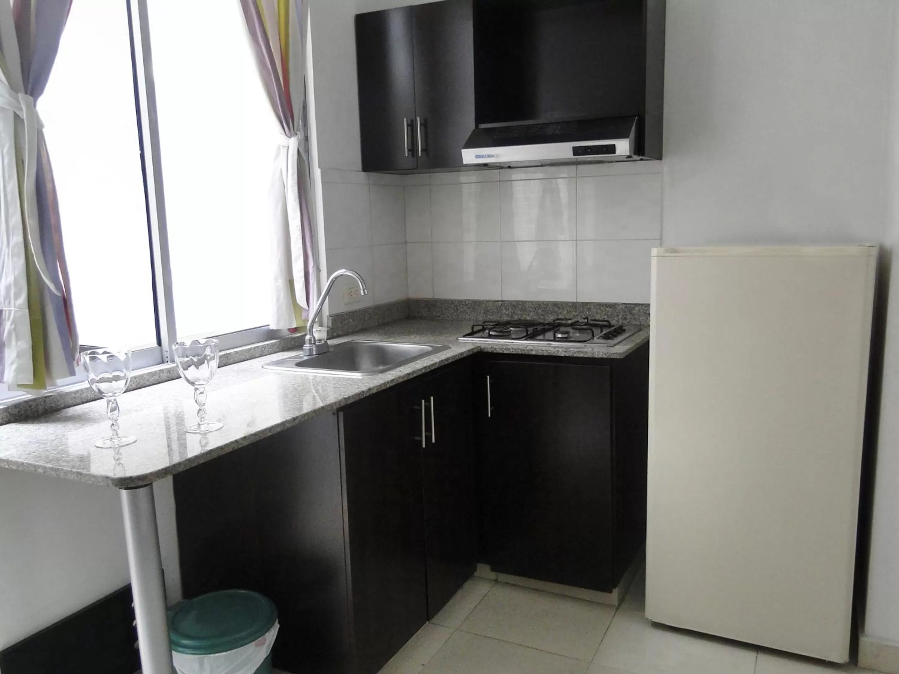 Kitchen or kitchenette in Arco Apartasuites