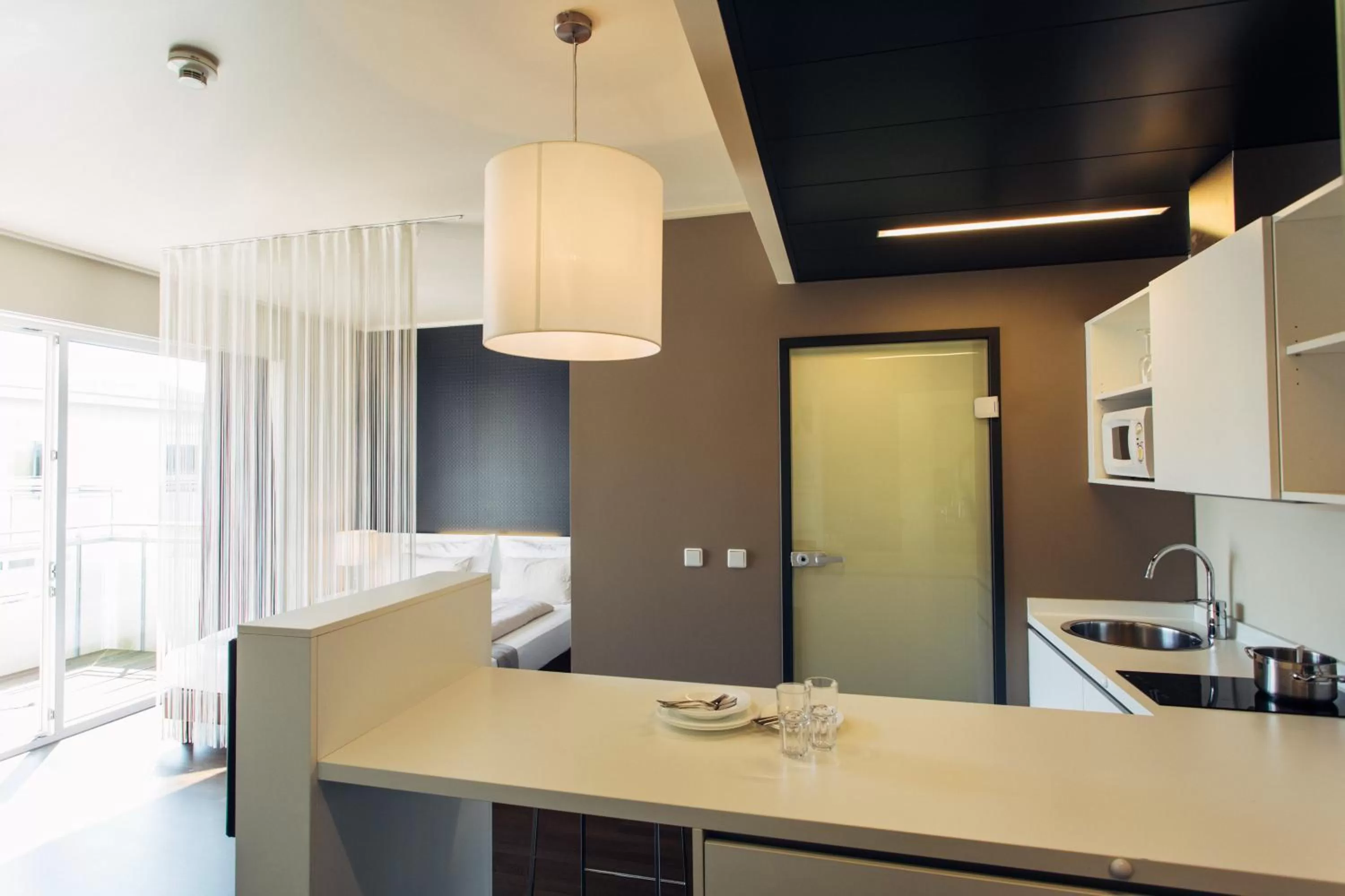 Kitchen or kitchenette in harry's home Linz-Urfahr hotel & apartments