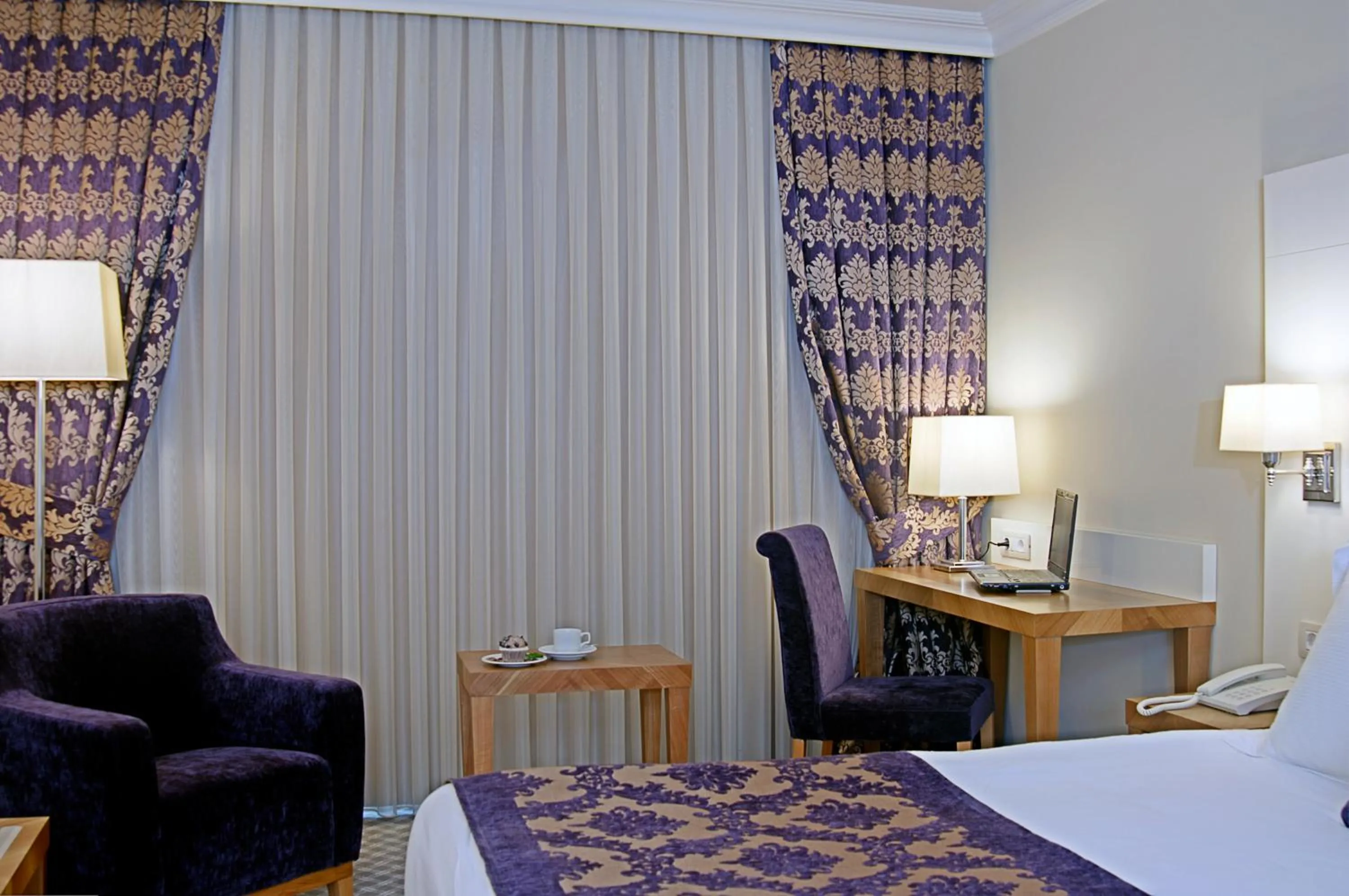 Communal lounge/ TV room, Bed in Tugcu Hotel Select