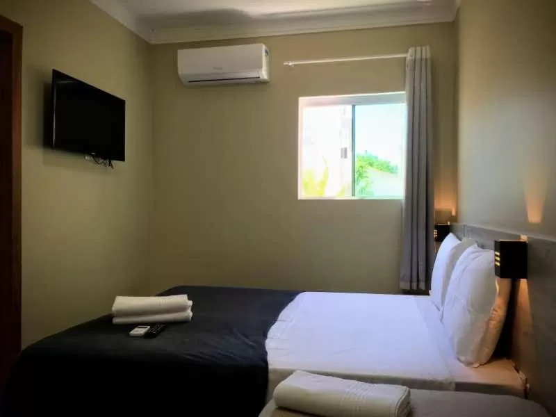 Bed in Pousada Tissiano