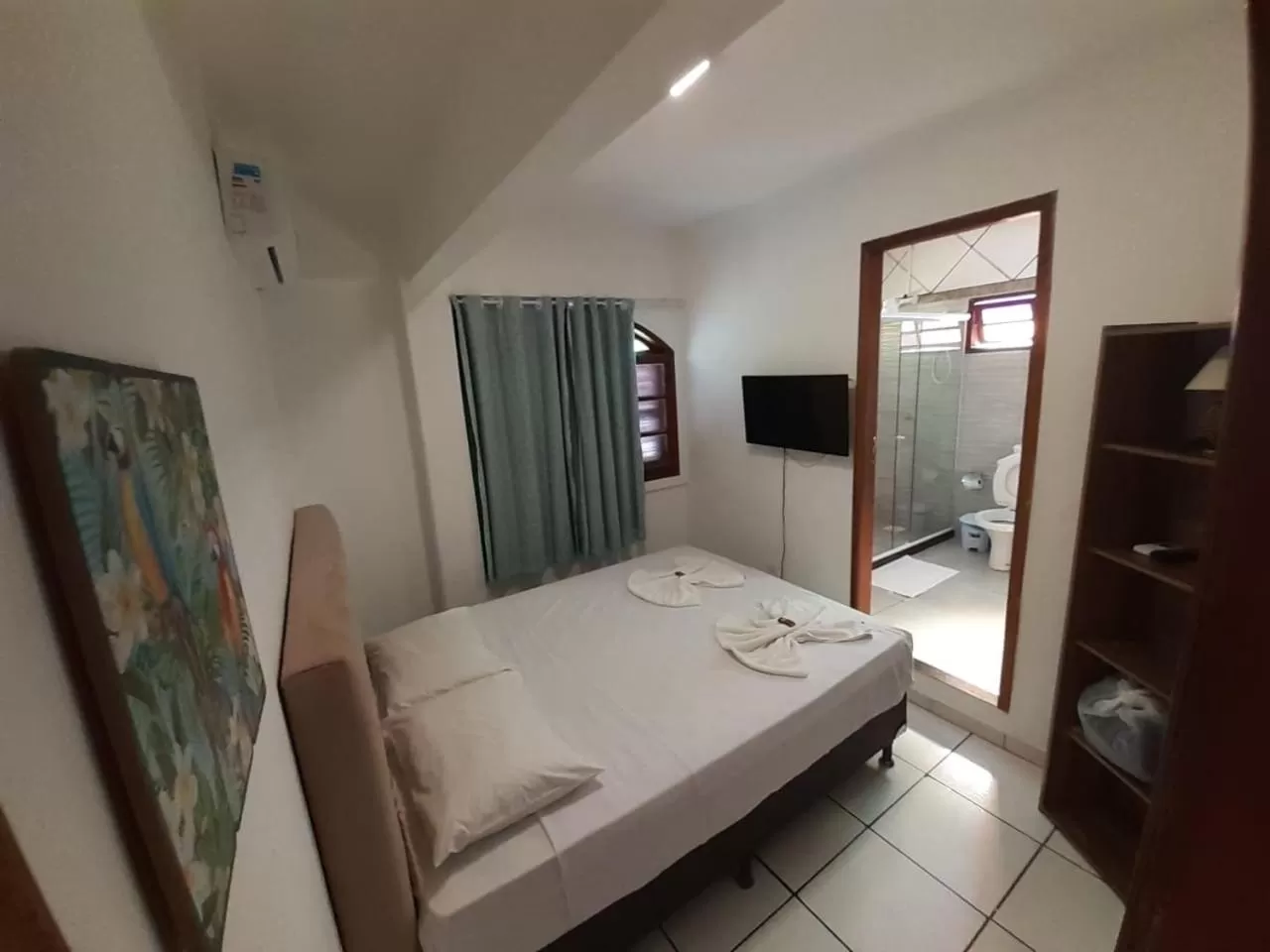 Bed in Flamingo Beach Pousada