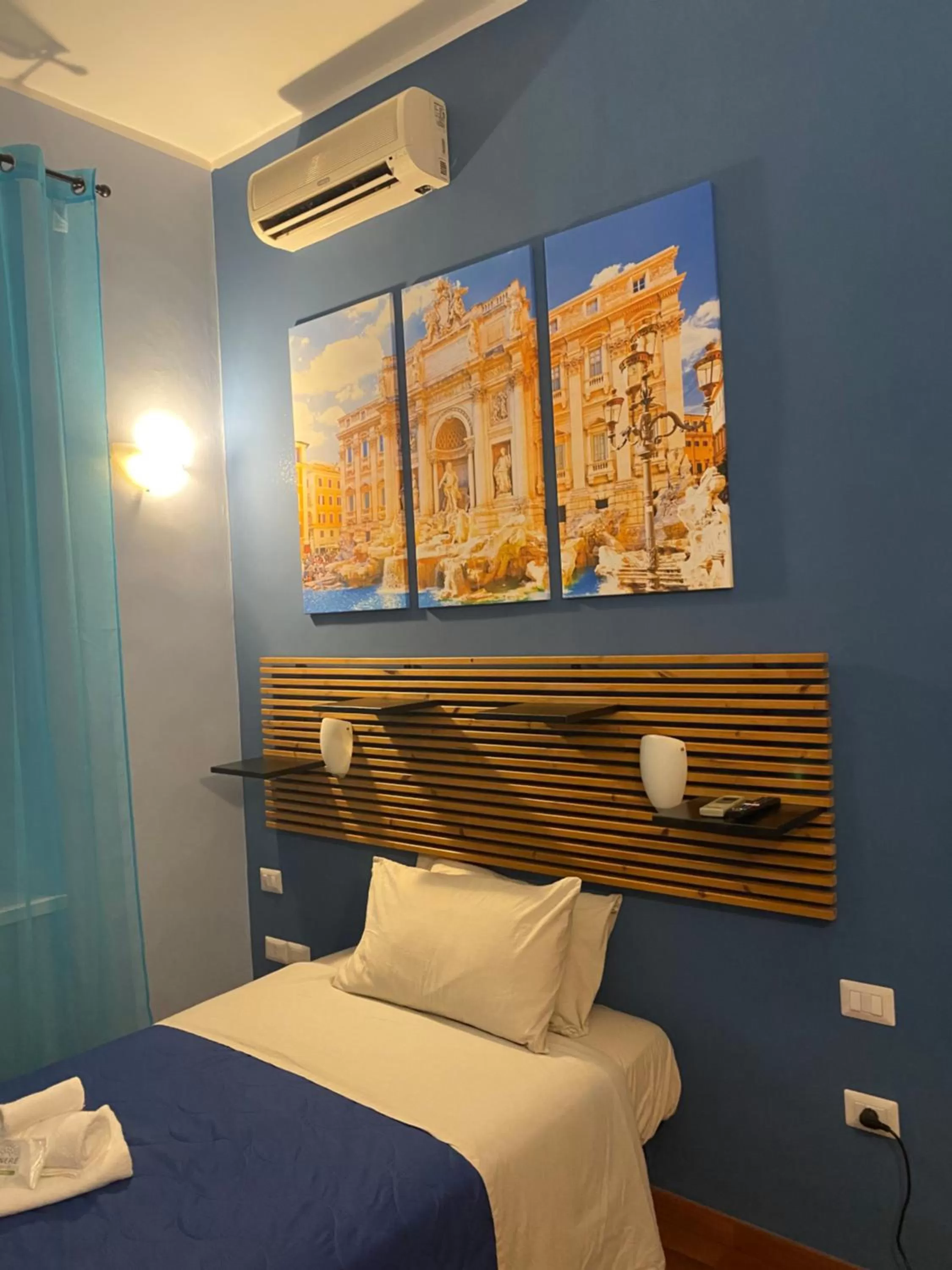 Bed in AmareRomaRooms