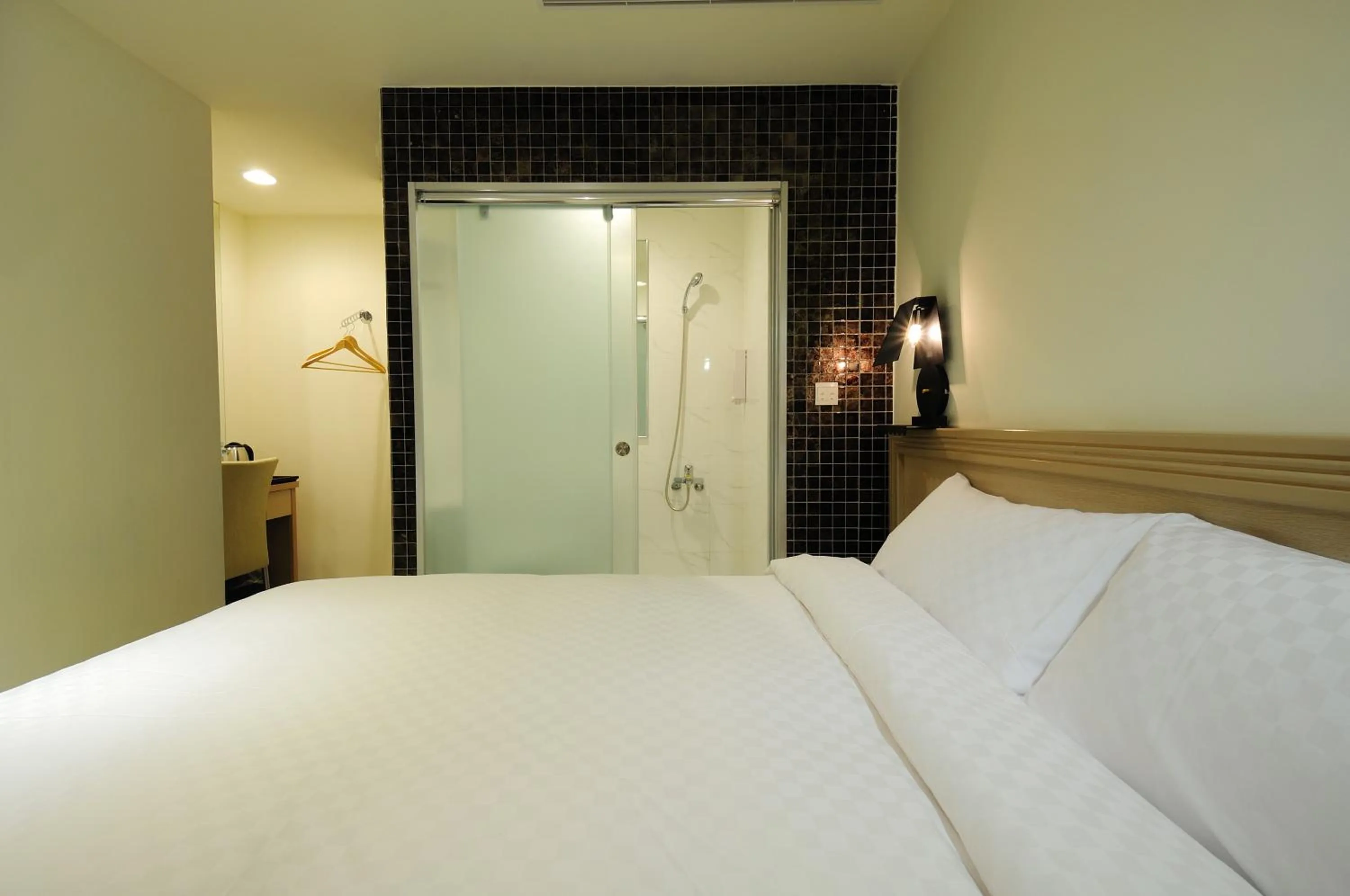 Bed in 安可旅店 Bravo Hotel