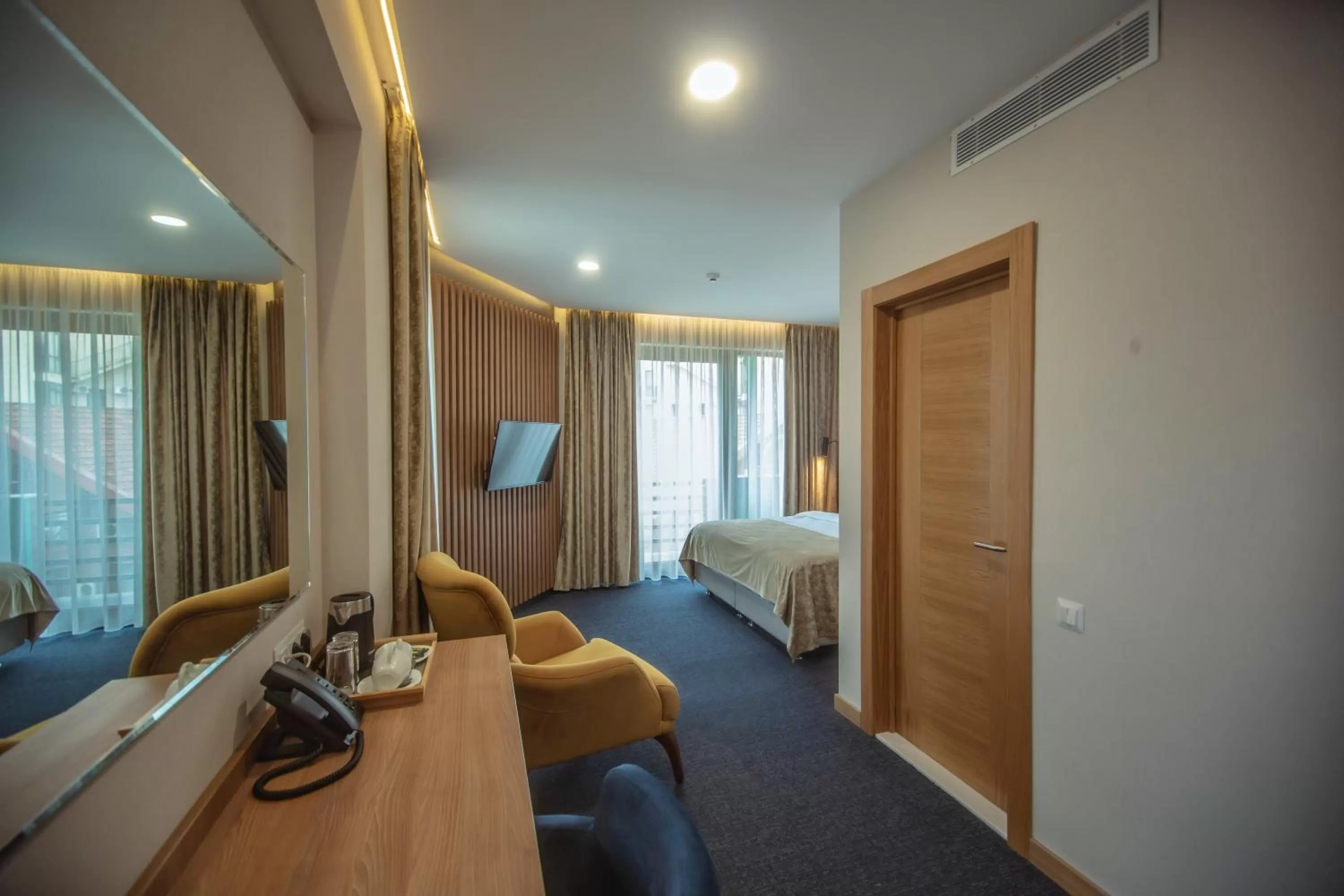 Bed, TV/Entertainment Center in Hotel Banovani