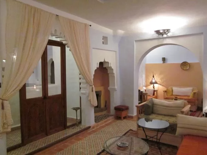 Communal lounge/ TV room, Bed in Hôtel Ras El Maa