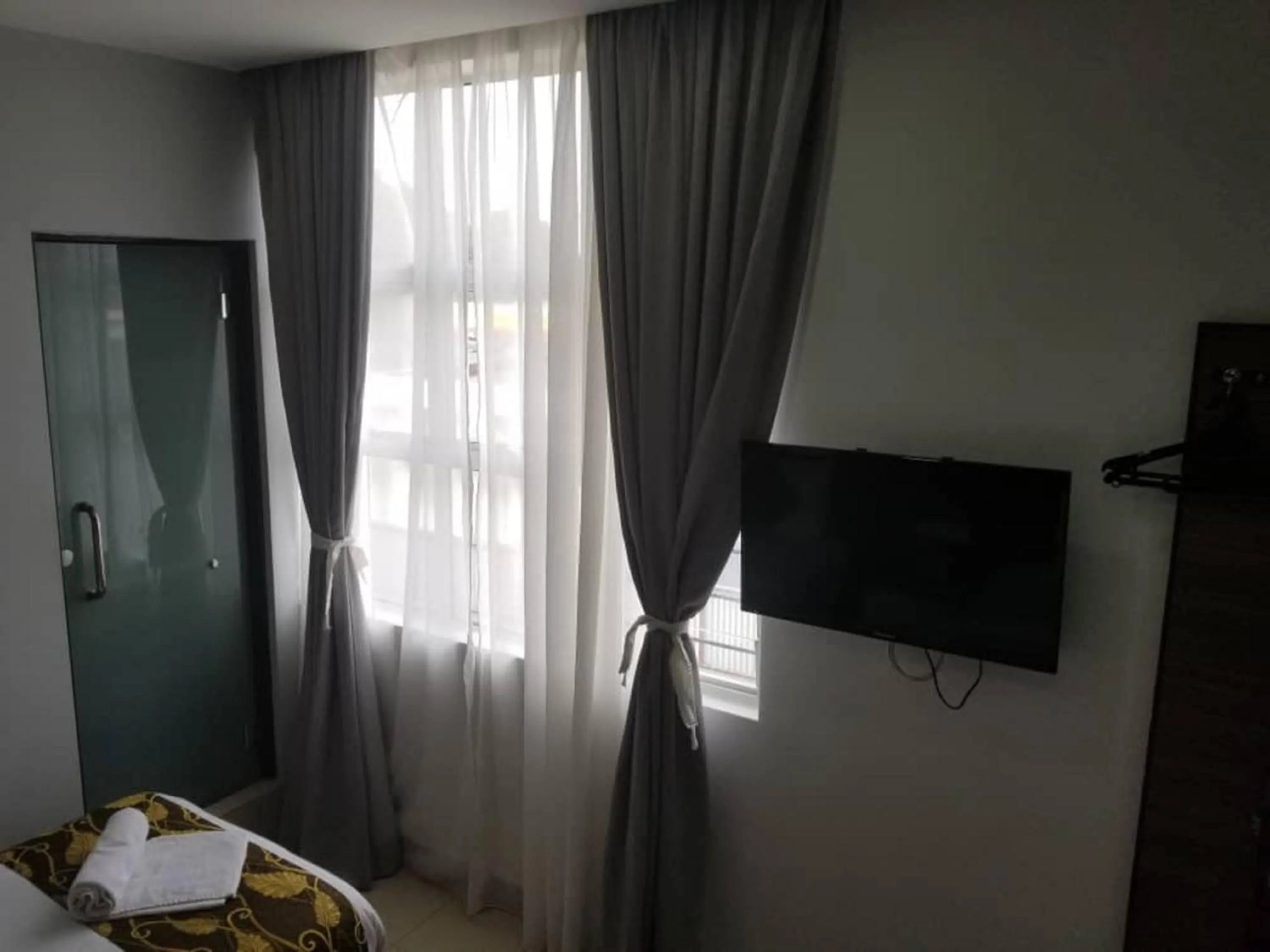 Photo of the whole room, Bed in D'Metro Hotel