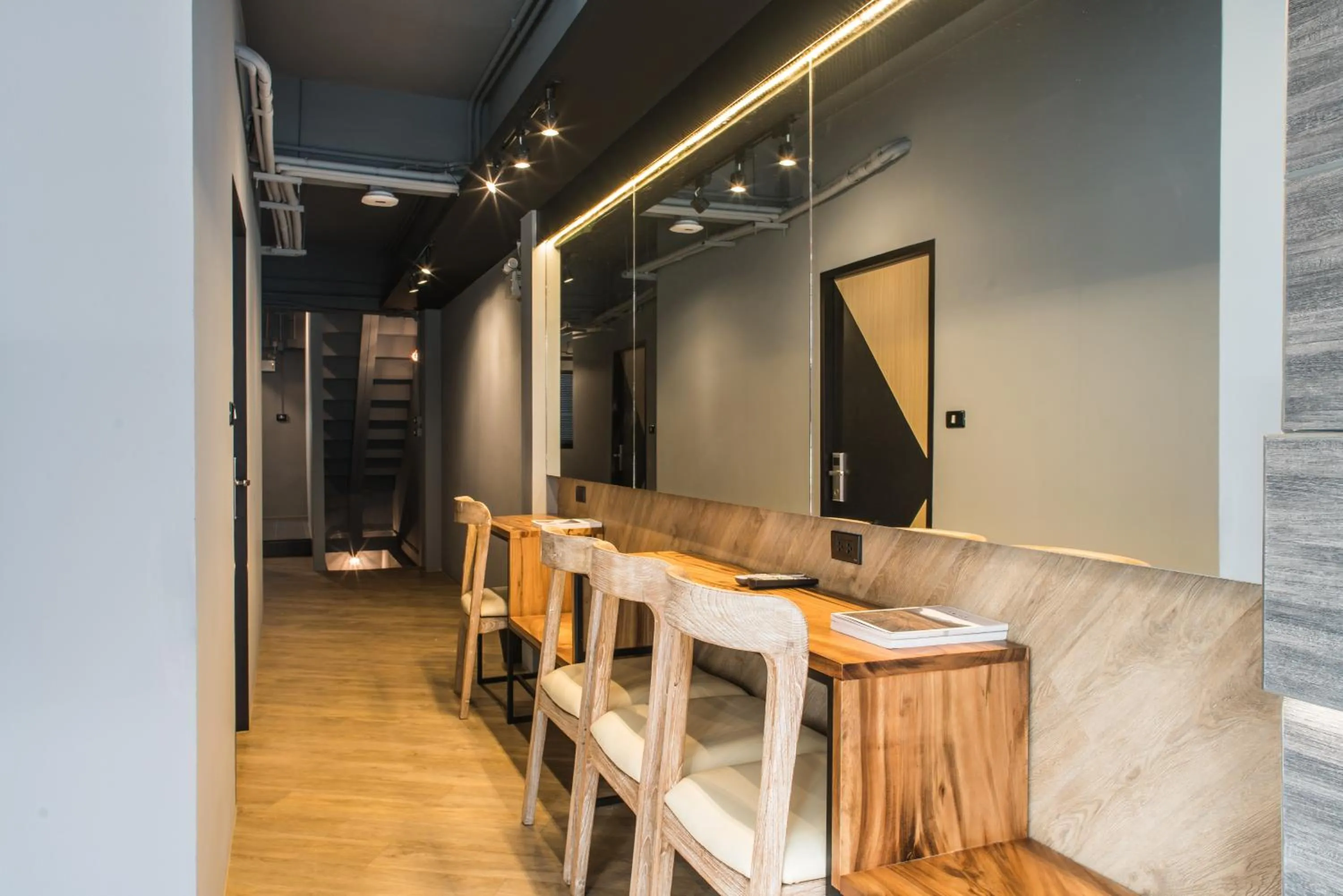 Communal lounge/ TV room in Sleep Box Patong Hostel