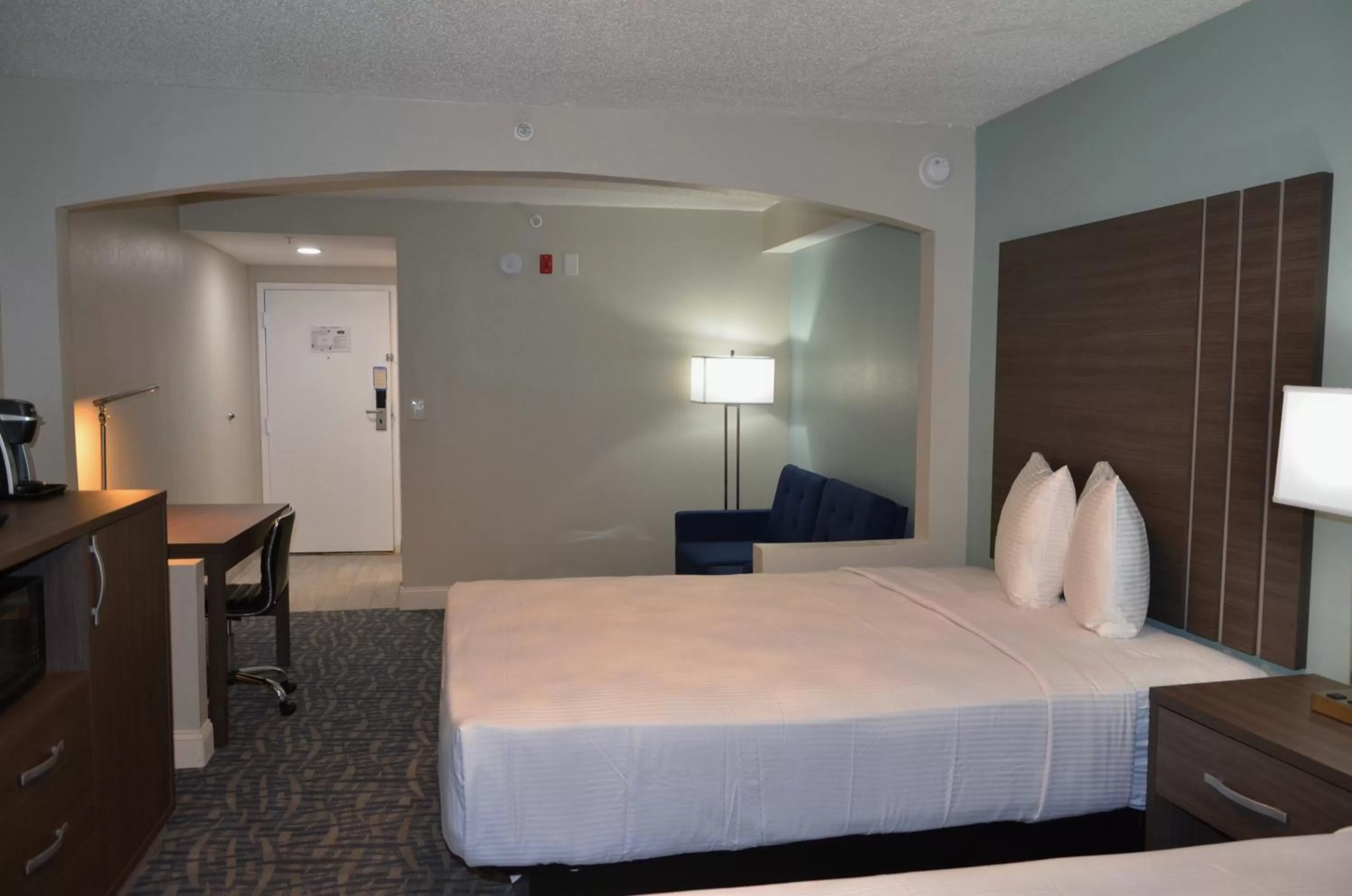 Bed in Opal Hotel & Suites