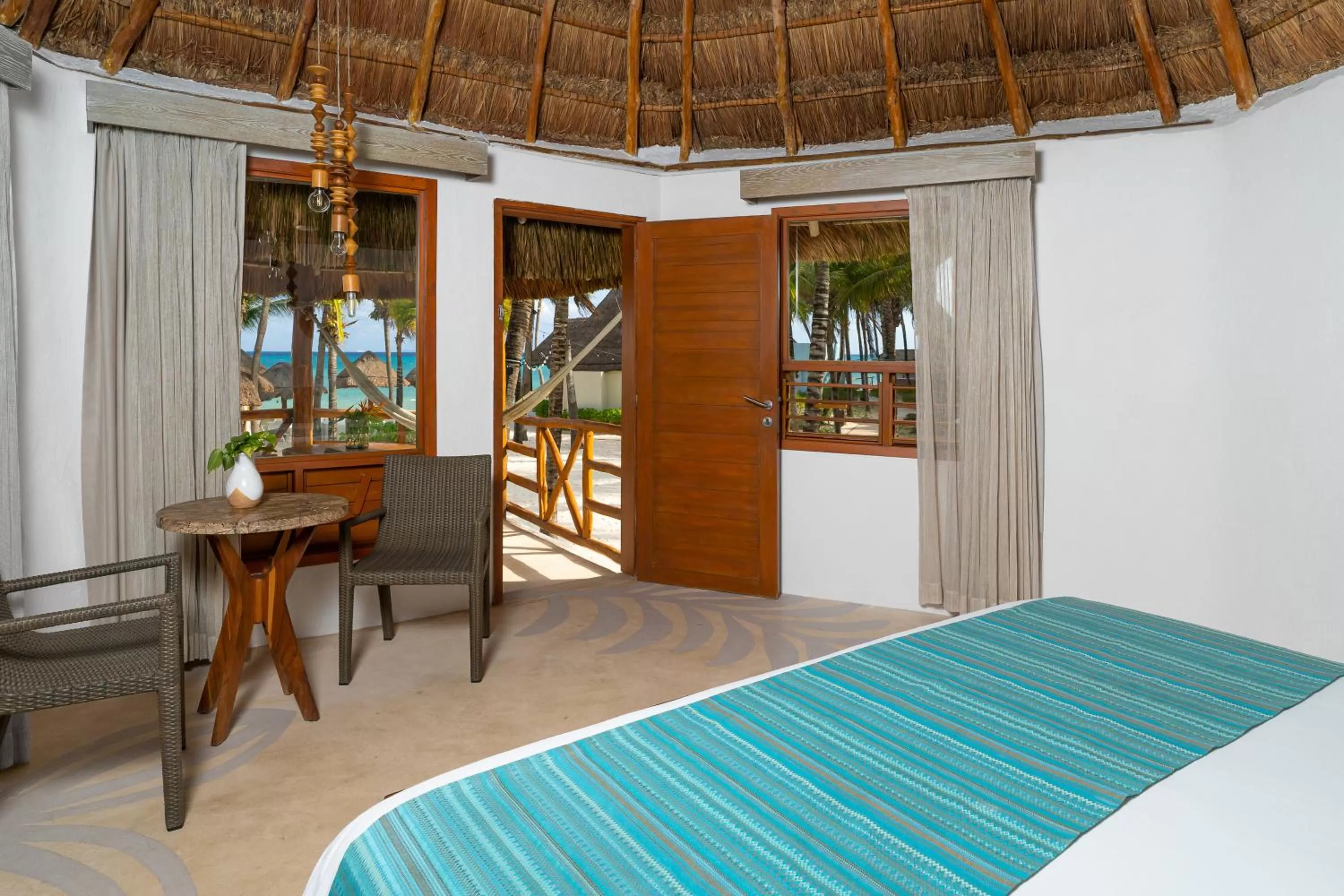 Bed in Mahekal Beach Front Resort & Spa