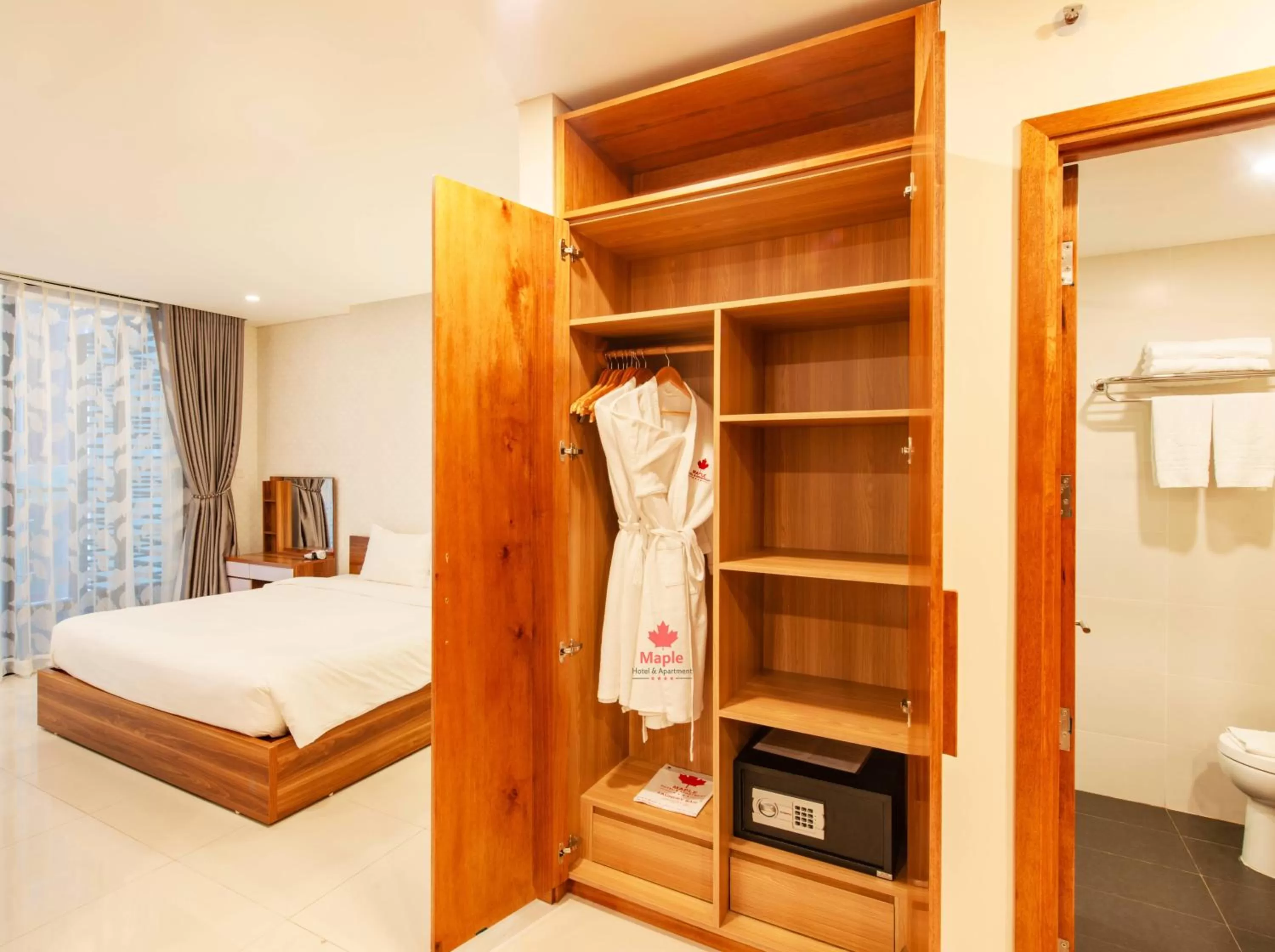wardrobe, Bed in Maple Hotel & Apartment