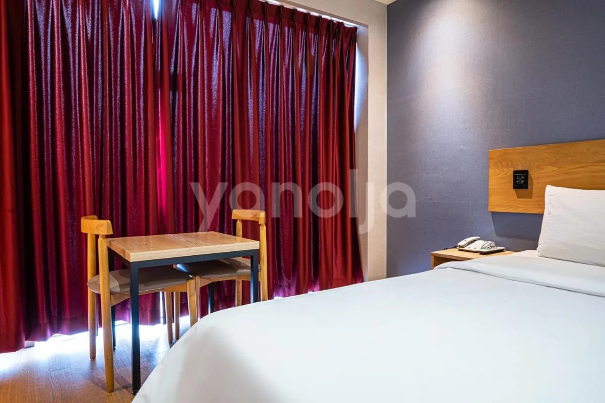 Bed in La Villa Hotel