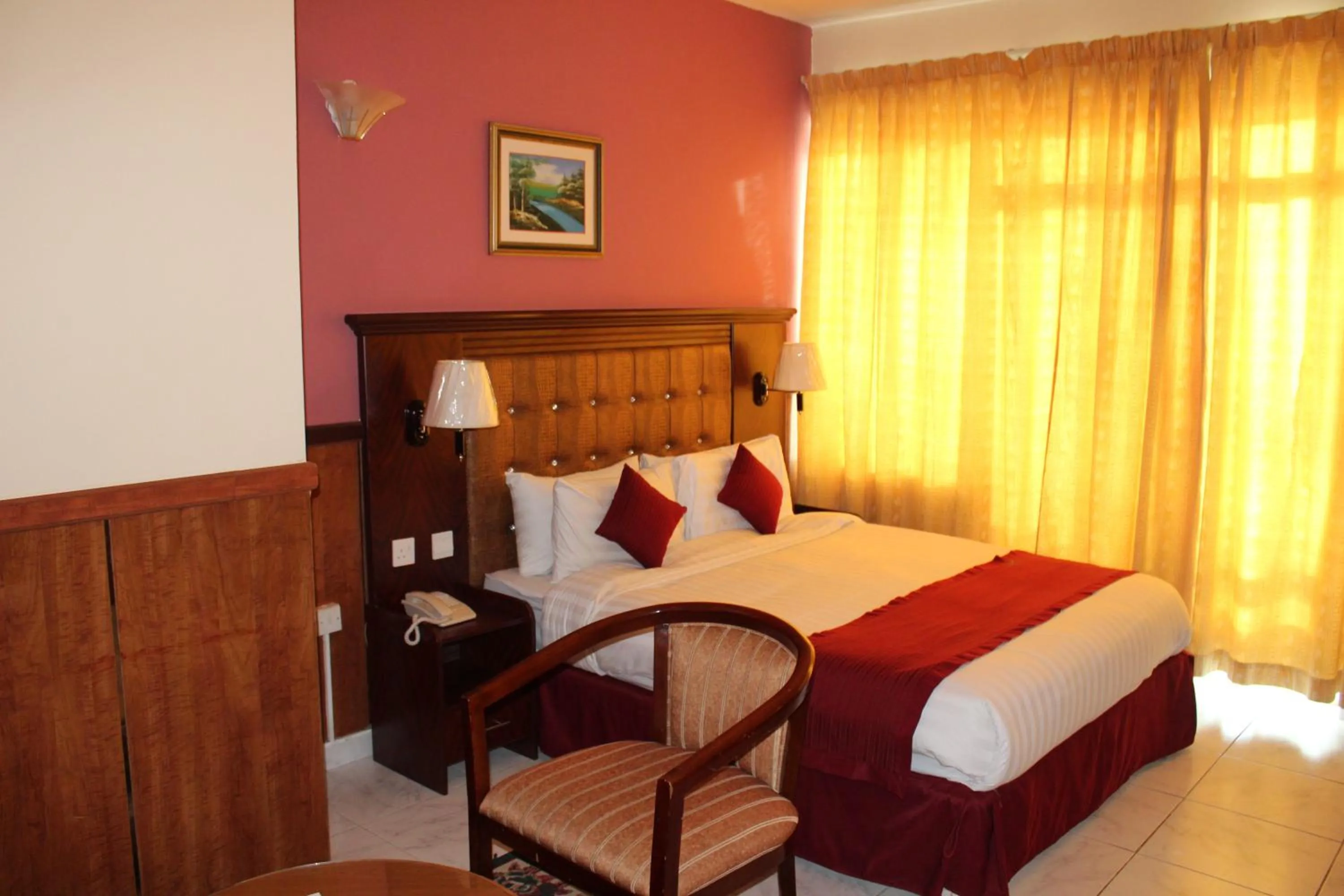 Bed in Grand Nova Hotel