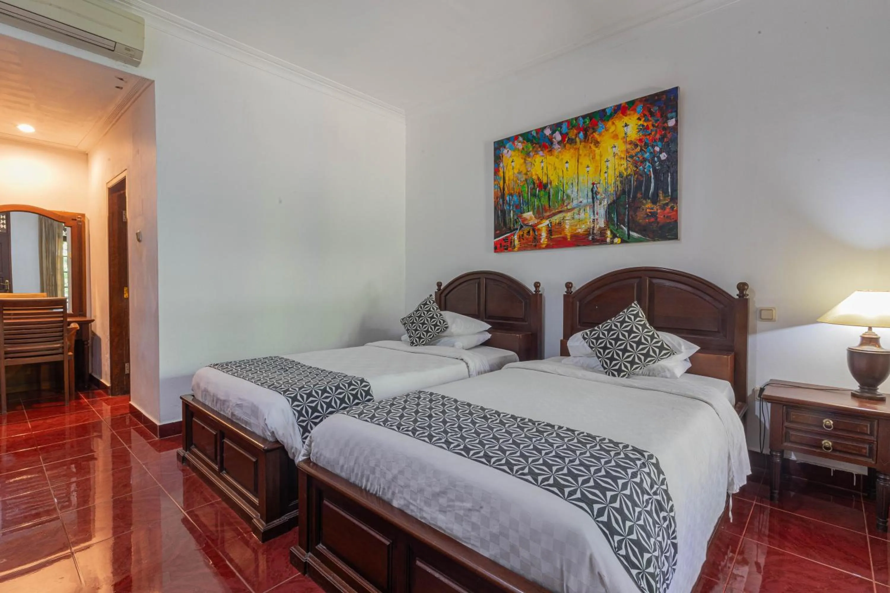 Bed in Puri Mango Guest House Sanur