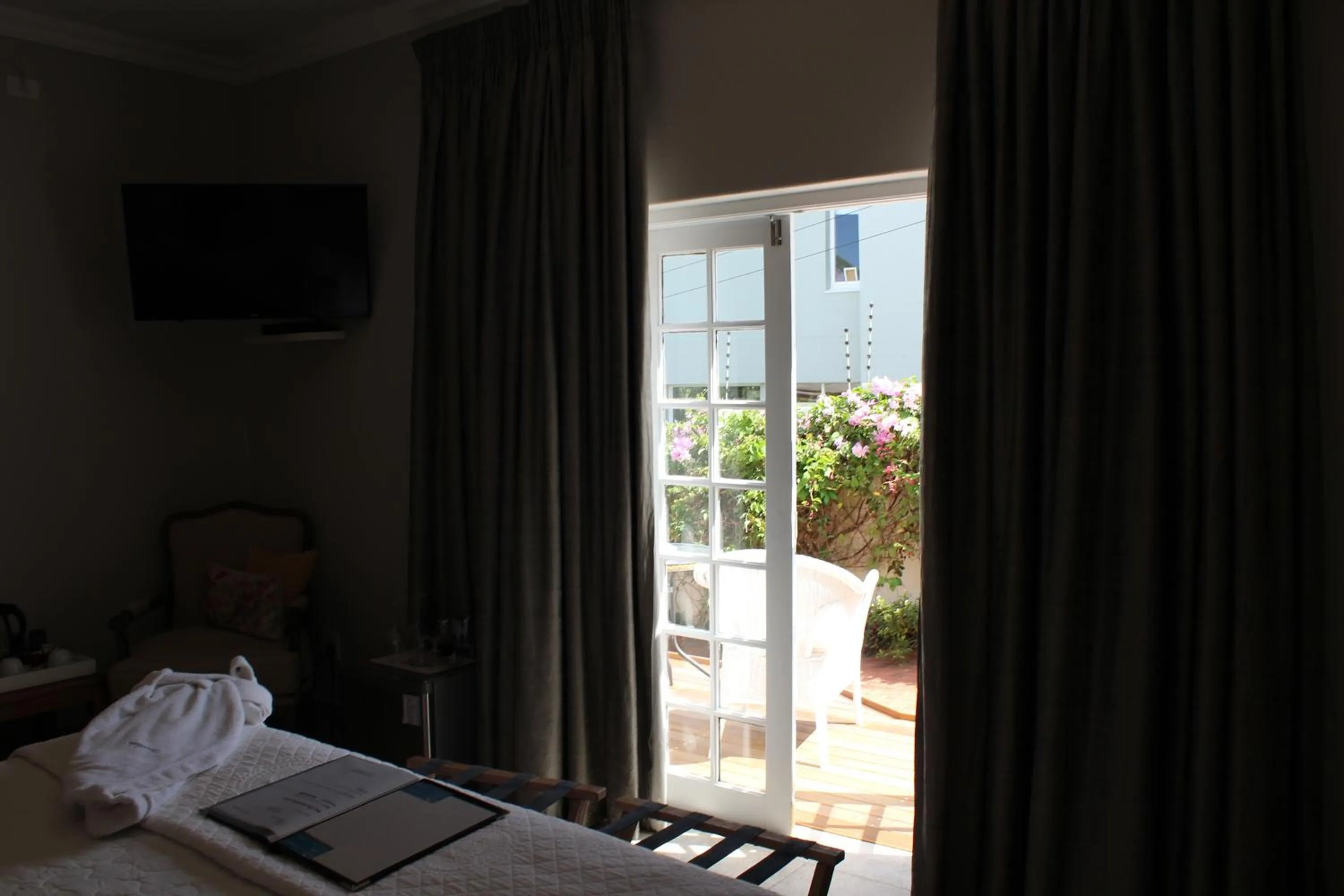 Garden view, Bed in Sandals Guest House