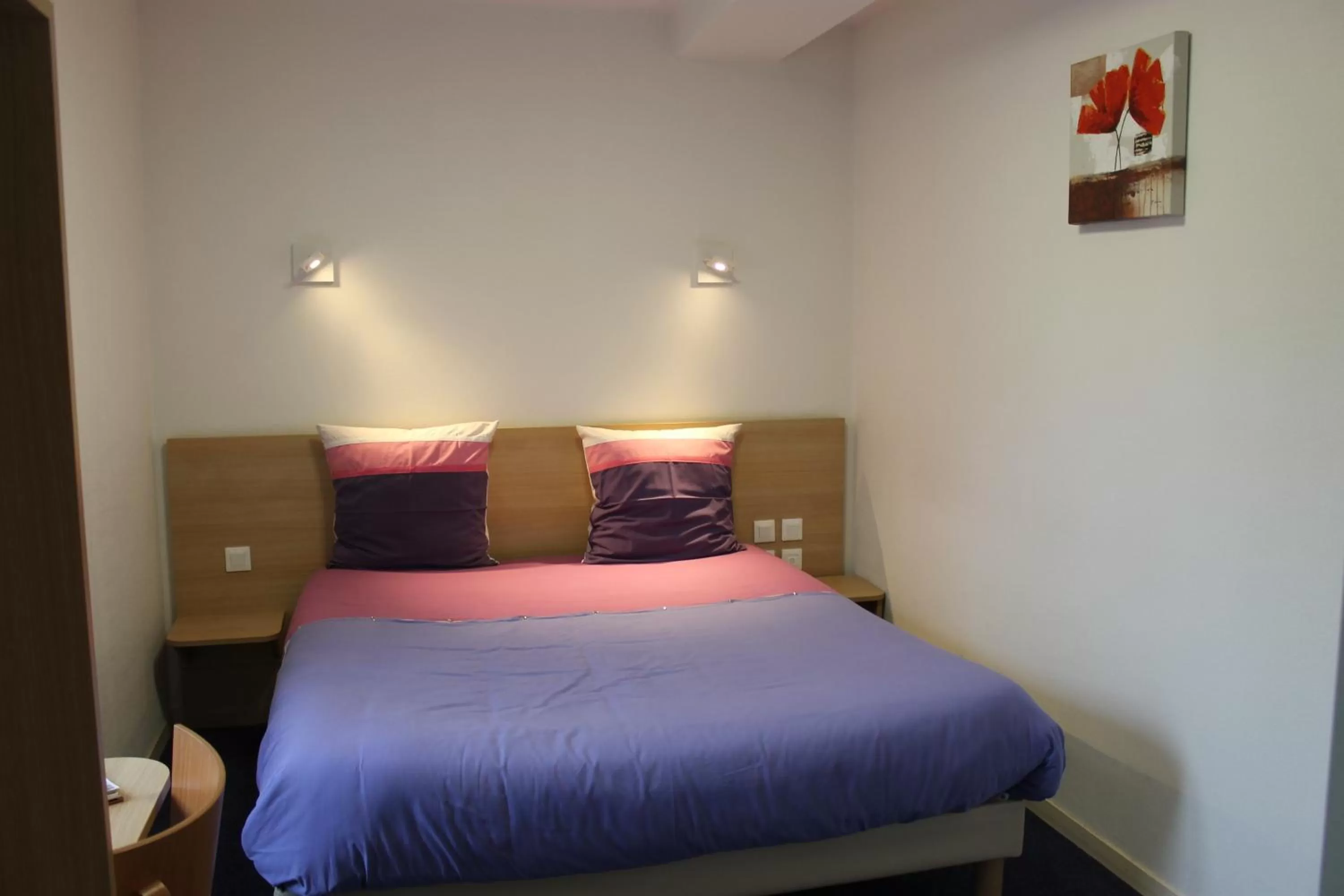 Bed in Hôtel du lion d'or