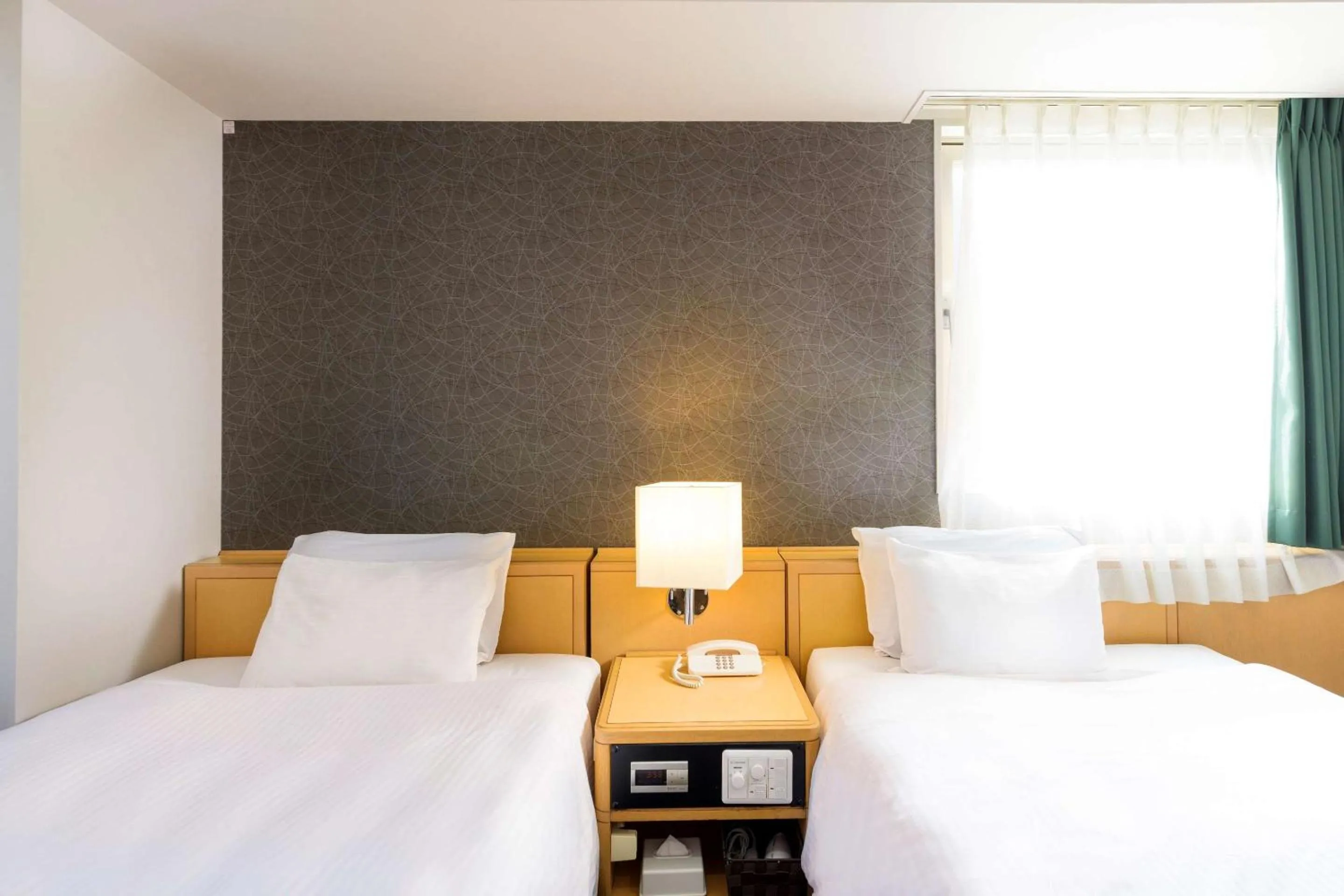 Bedroom in SureStay Plus Hotel by Best Western Shin-Osaka