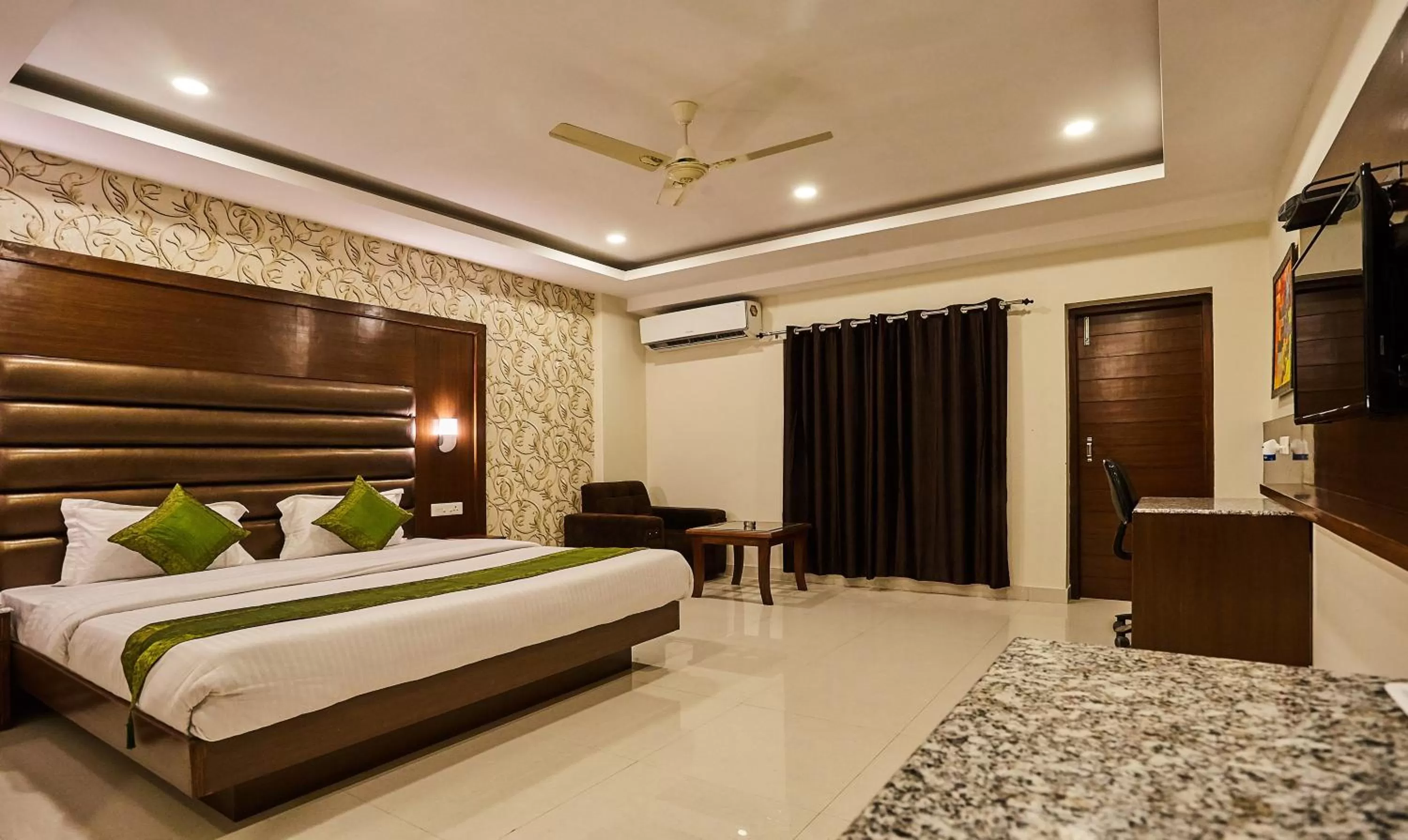 Bedroom, Bed in Treebo Grand Legacy Elite With Roof Top Cafe