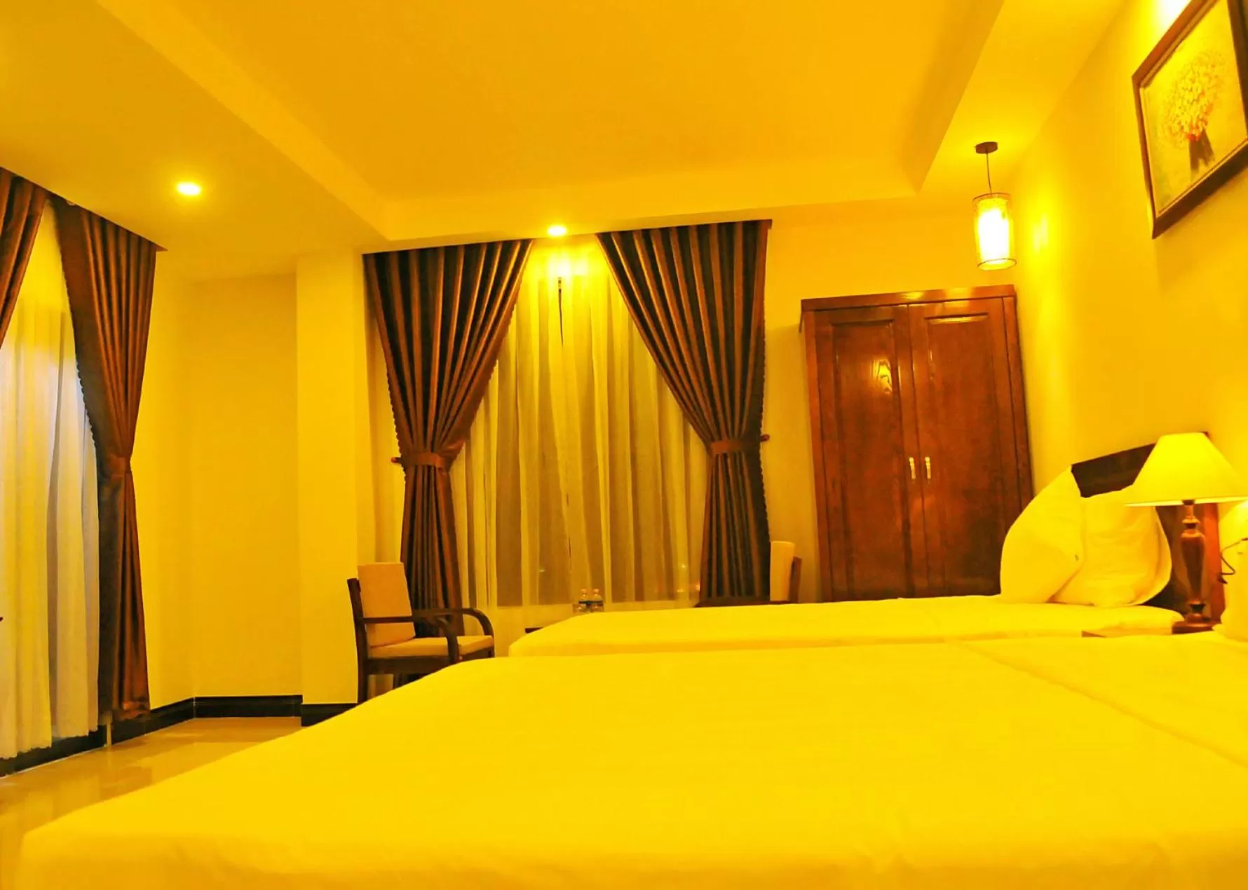 Bed in Aries Hotel
