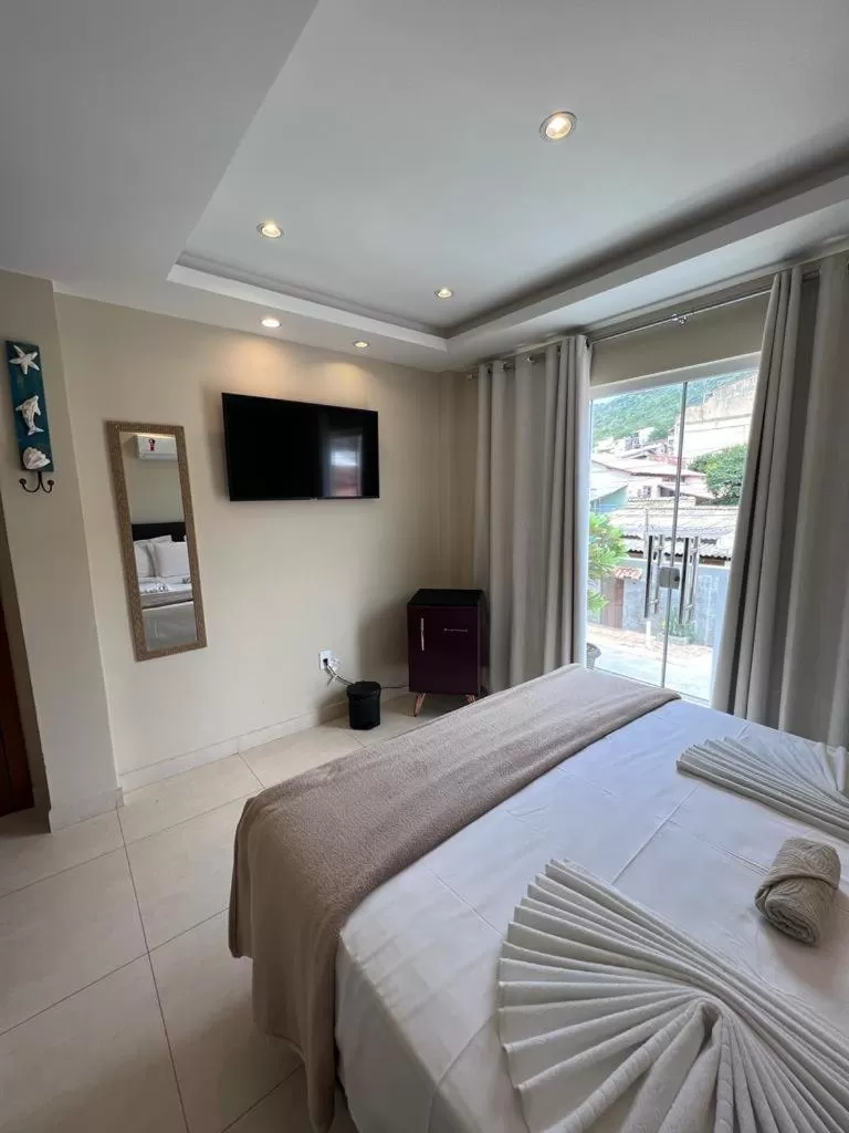 Bed in Pousada Arraial Tropical