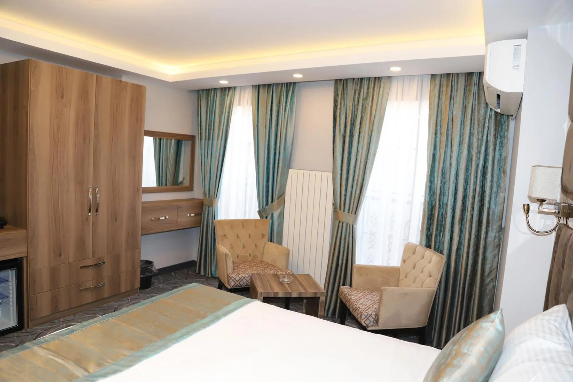 Bed in Grand Kavi Hotel