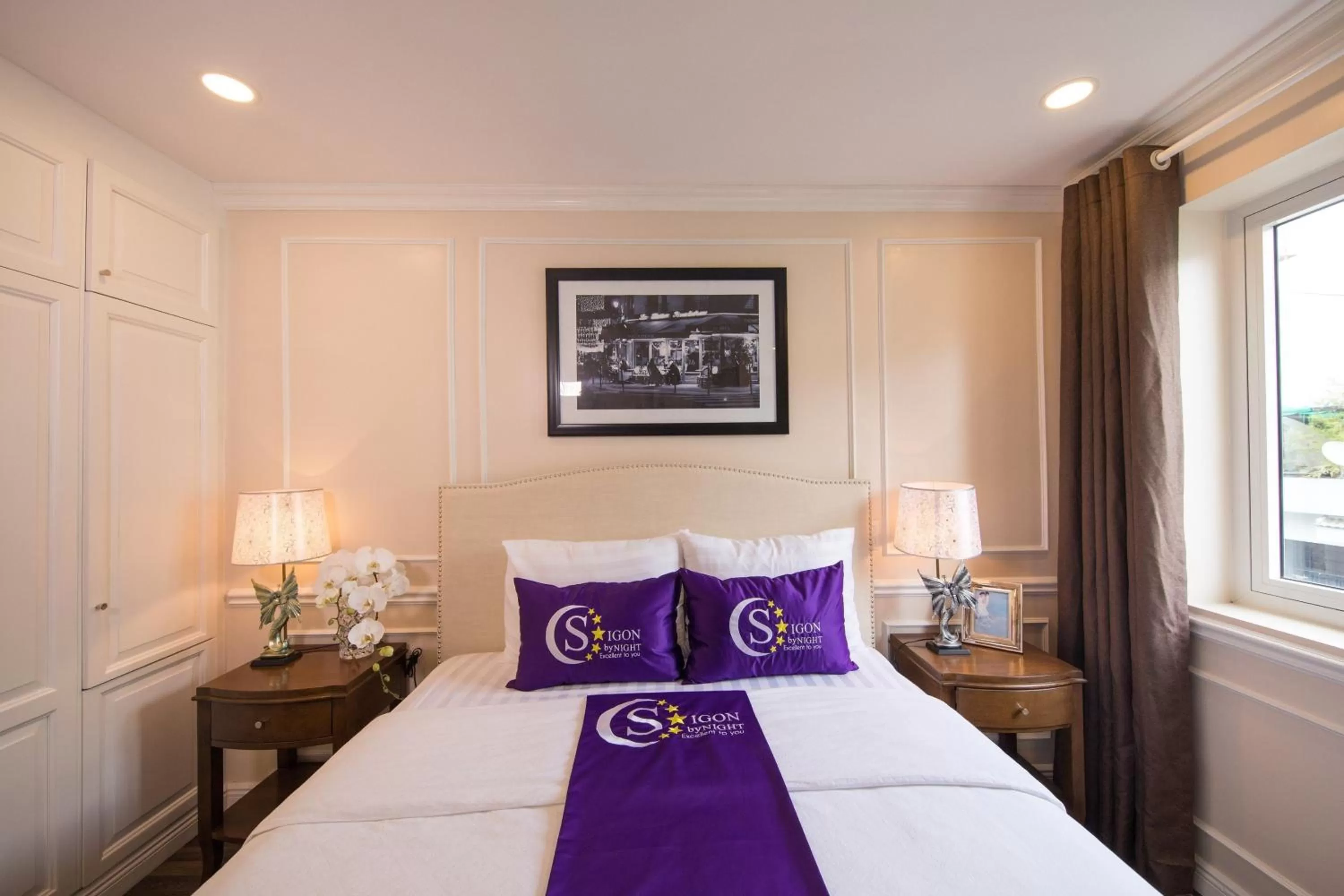 Bed in Saigon By Night Luxury Hotel