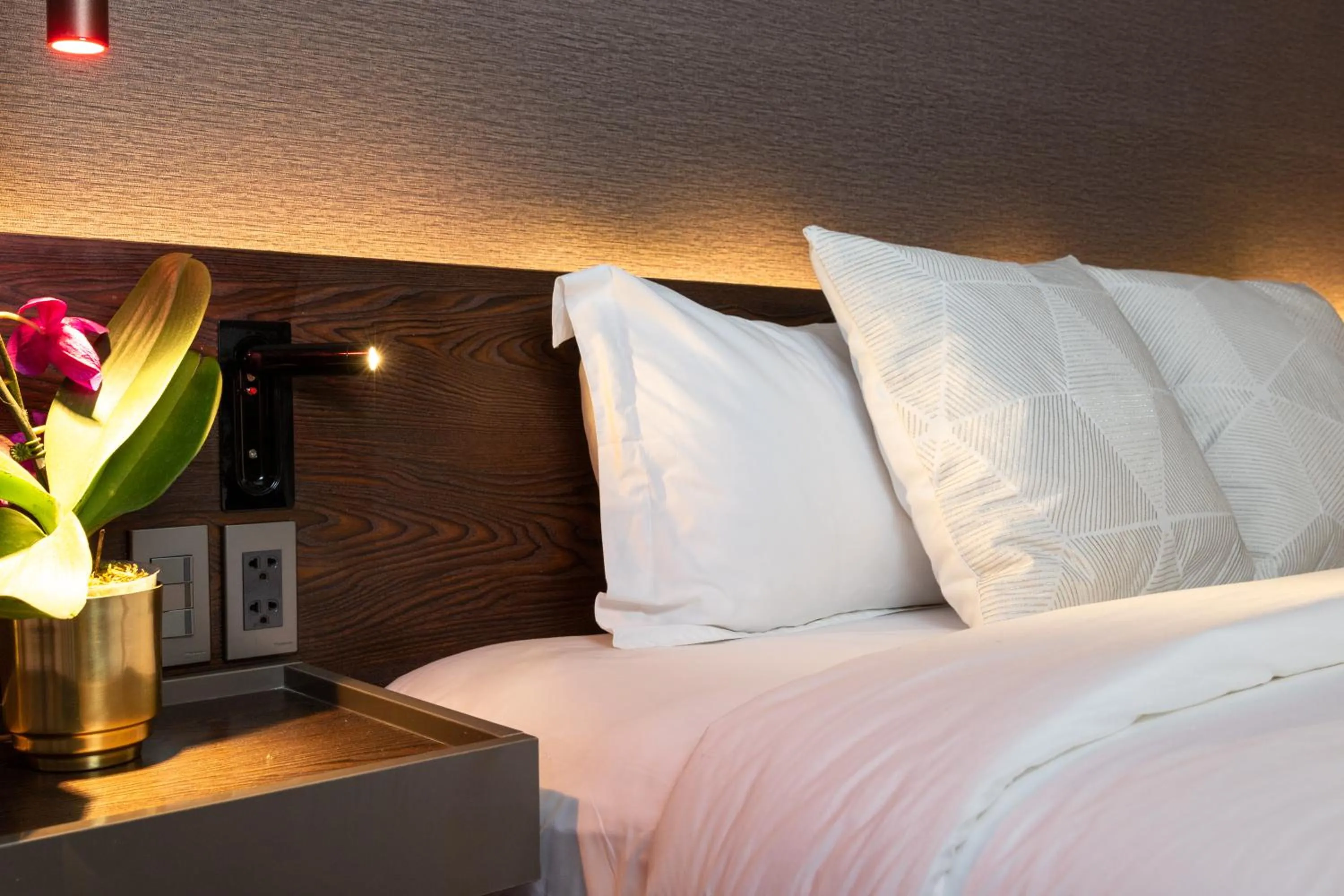 Bed in Ramada Encore by Wyndham Makati