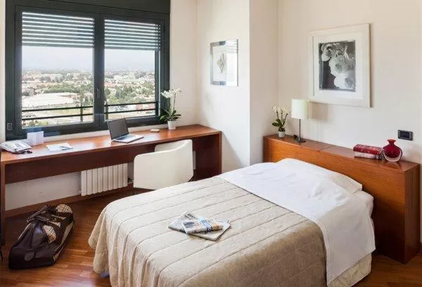 Bed in Cosmo Hotel Torri