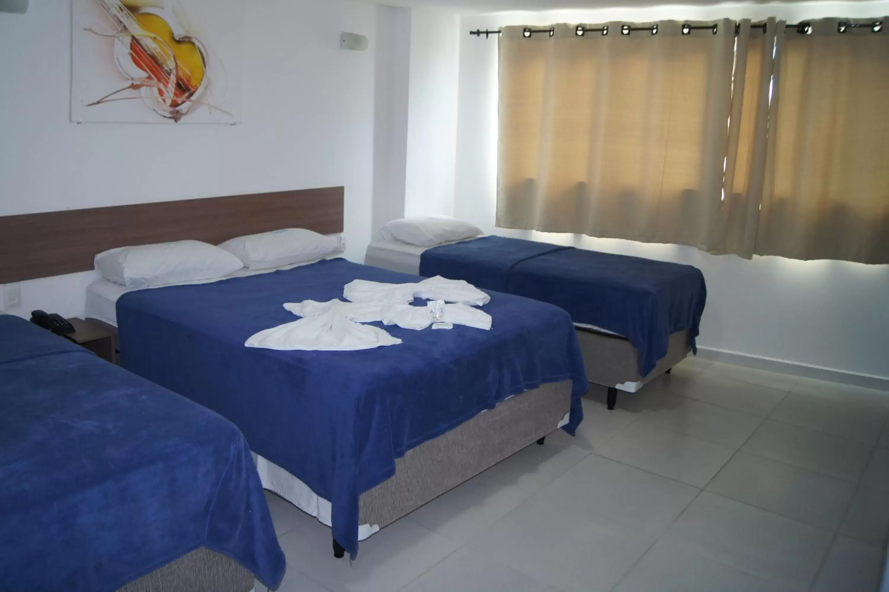 Comfort Quadruple Room in Anjos Praia Hotel Comfort Quadruple Room in Anjos Praia Hotel