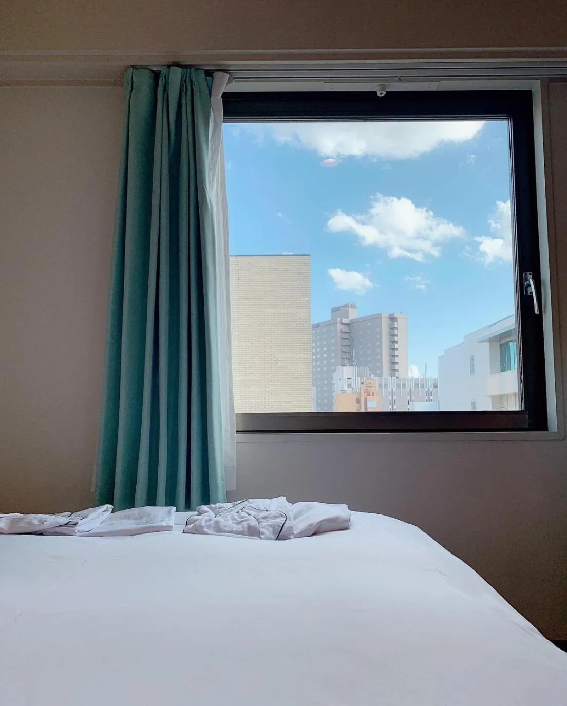 View (from property/room), Bed in Tmark City Hotel Sapporo
