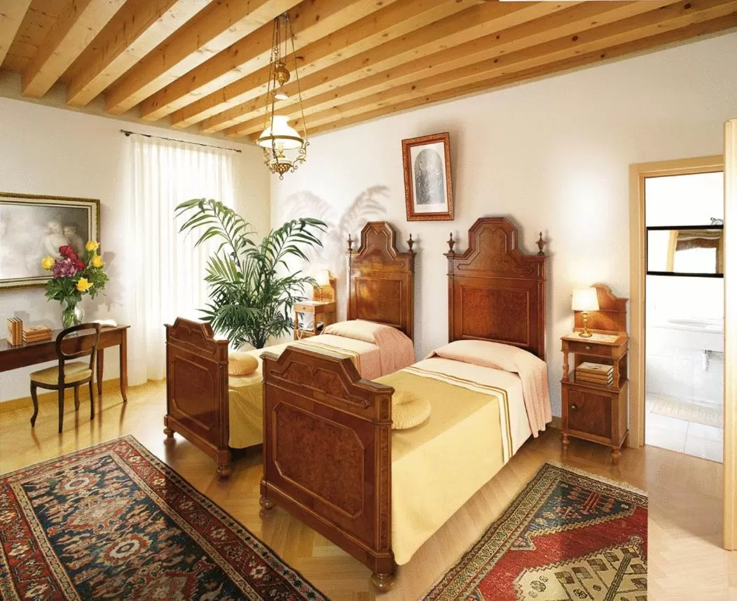 Bed in Villa Busta Hotel