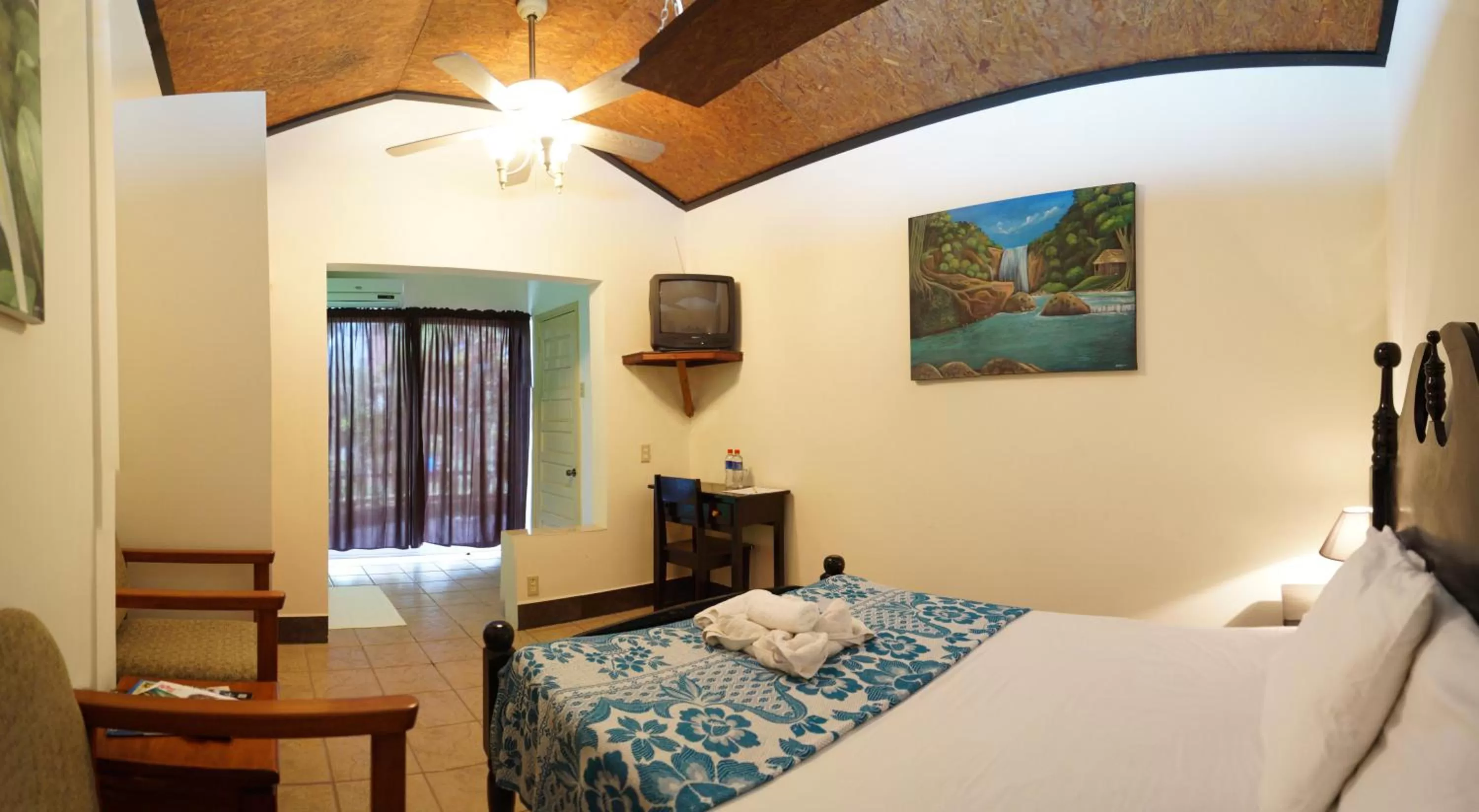 Bed in Rumors Resort Hotel