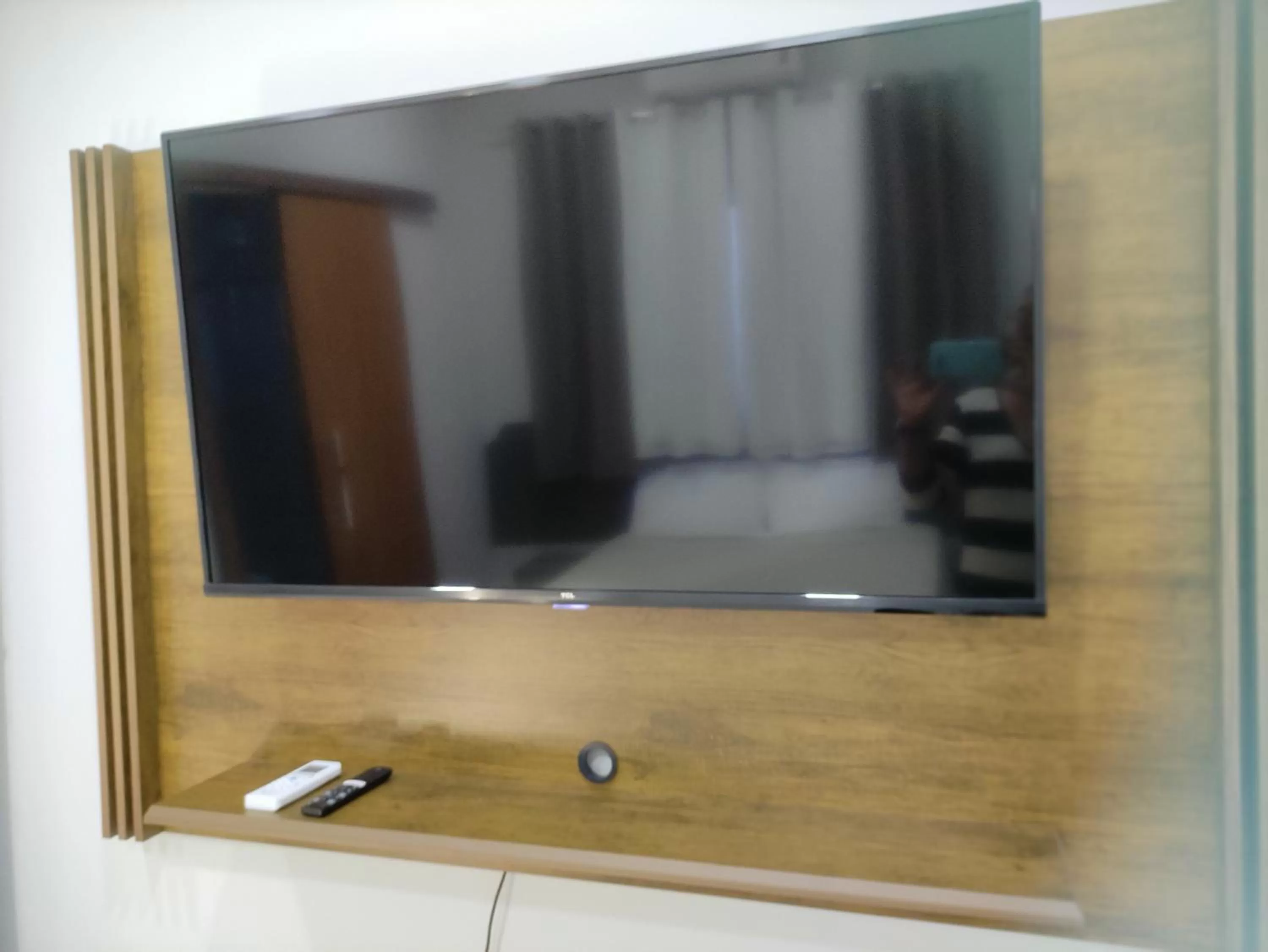 TV and multimedia, TV/Entertainment Center in Pousada da Gi Suítes e Turismo