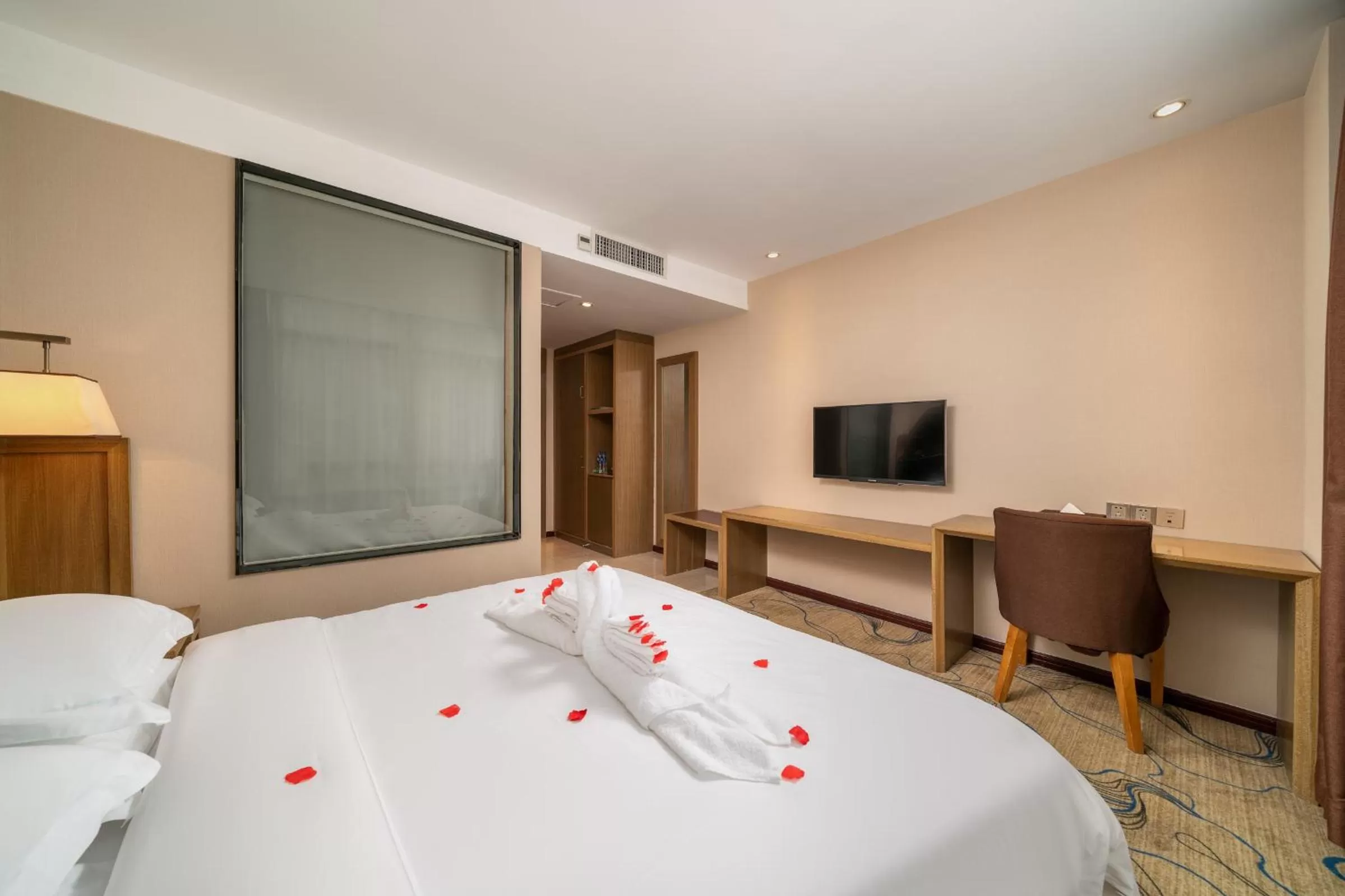 Bed in Guangzhou Boyi Hotel