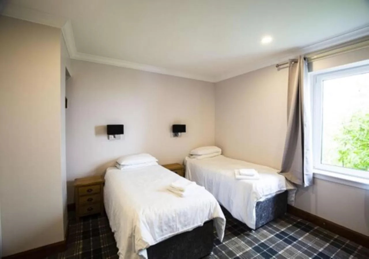 Bed in GOLF View Hotel & Macintosh Restaurant