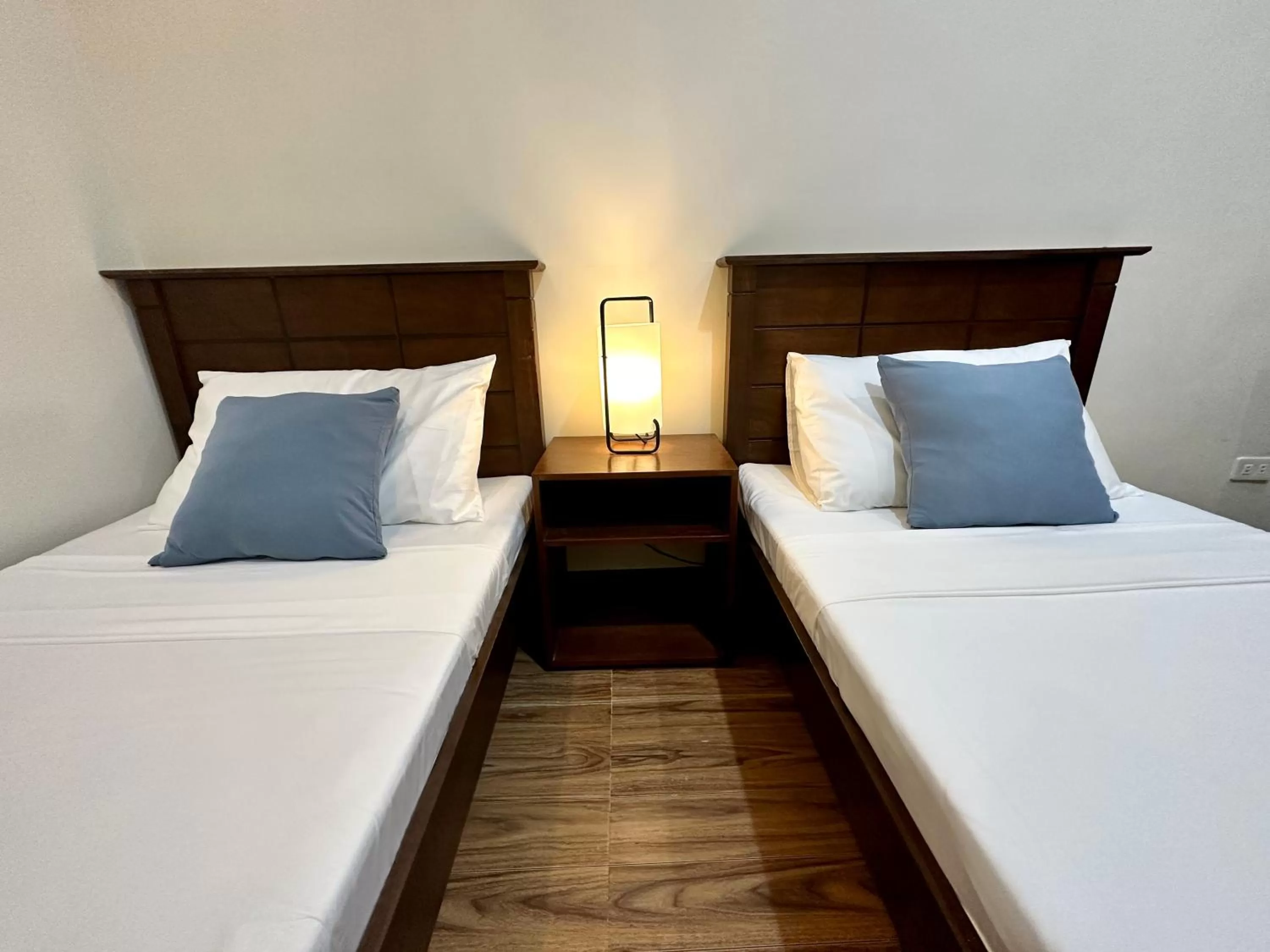 Bed in Harbour Bliss Hotel