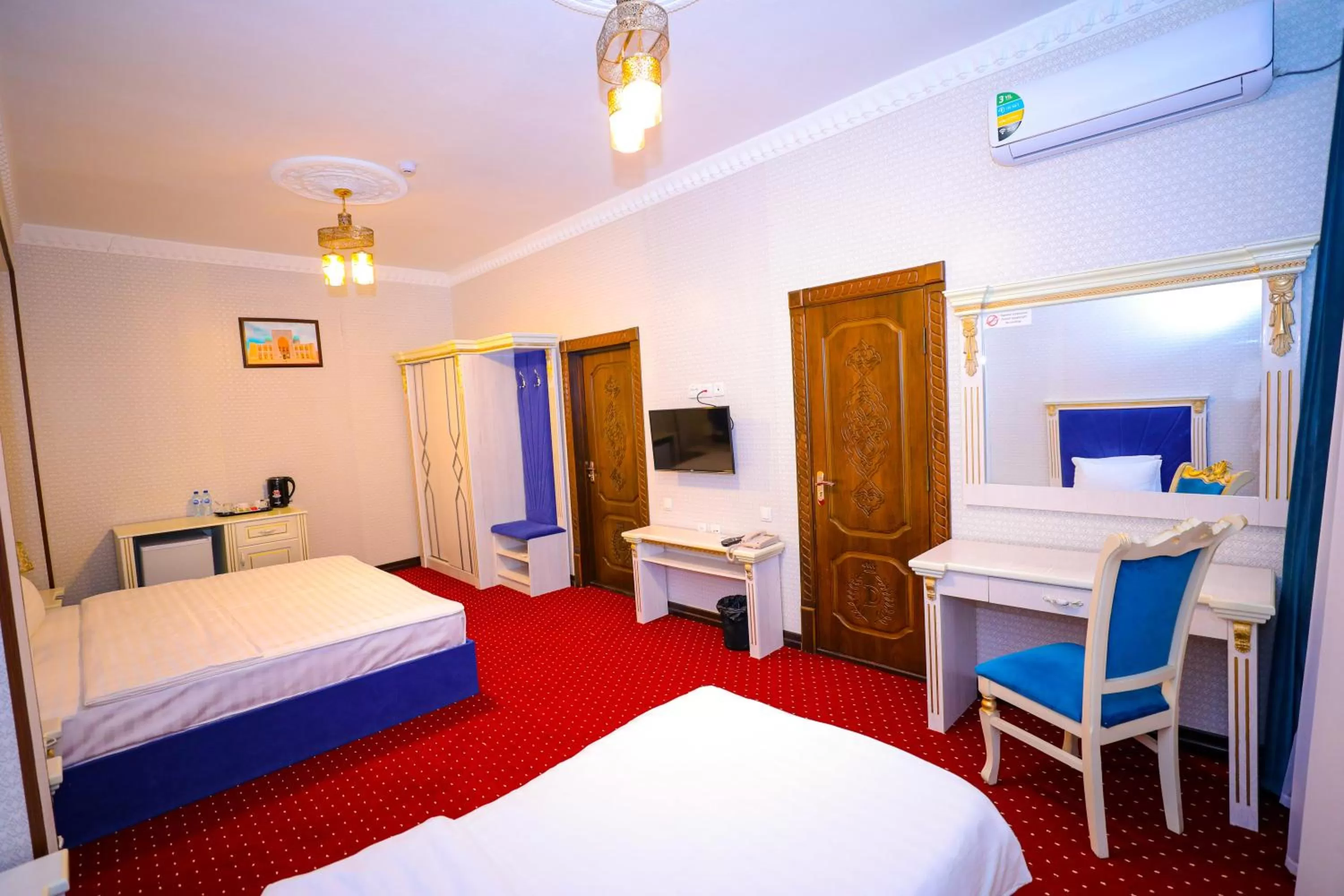 Communal lounge/ TV room, Bed in Dendi Plaza Hotel