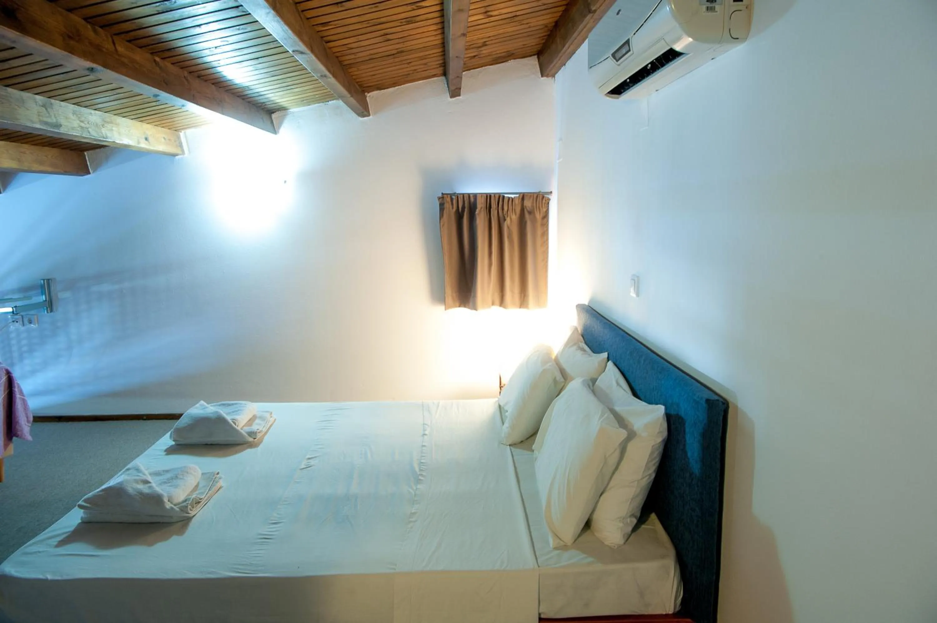 Bed in Elounda Sunrise Apartments