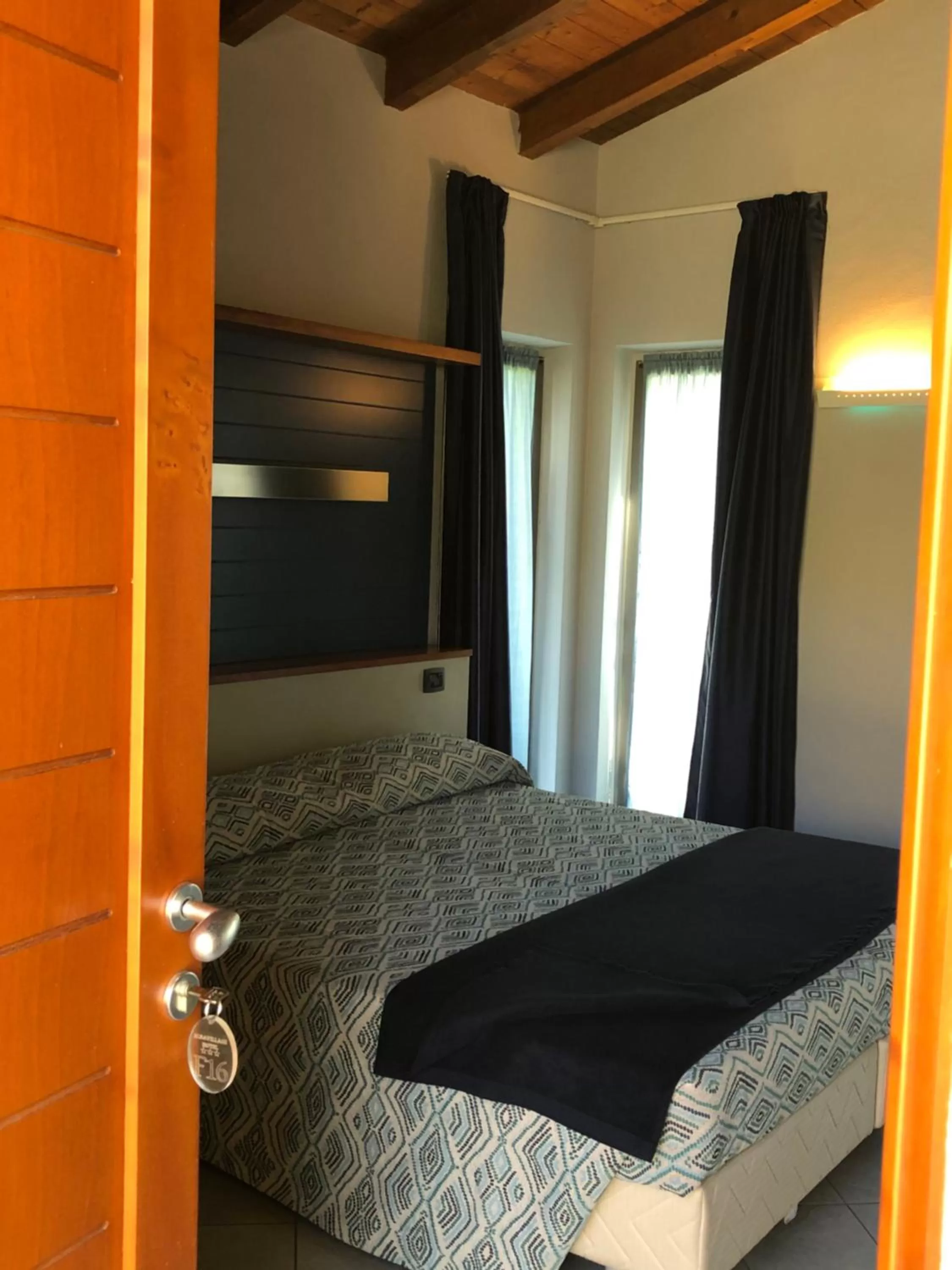 Bed in Albavillage Rooms & Camping