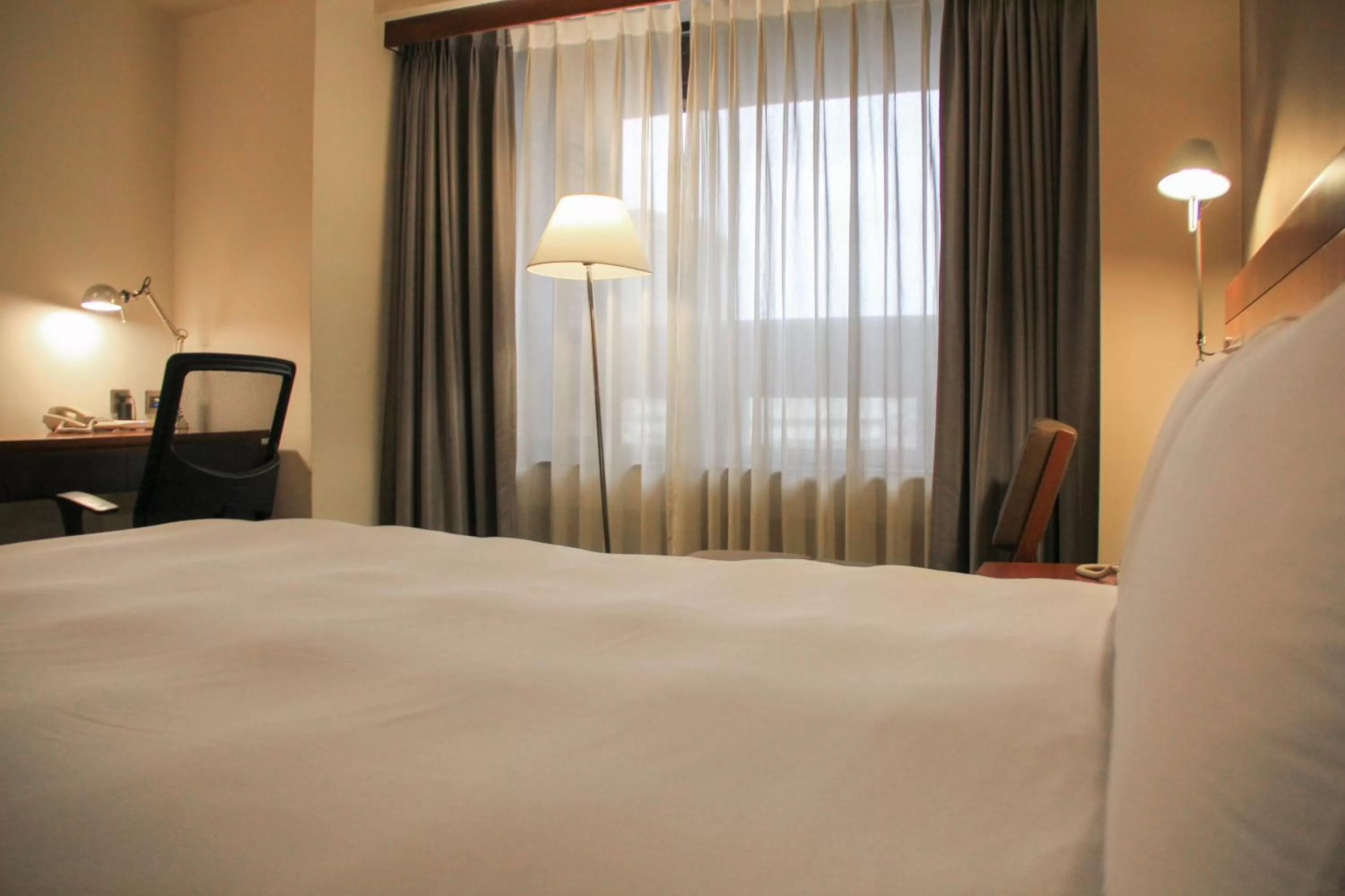 Bed in Guide Hotel Hsinchu Zhongyang